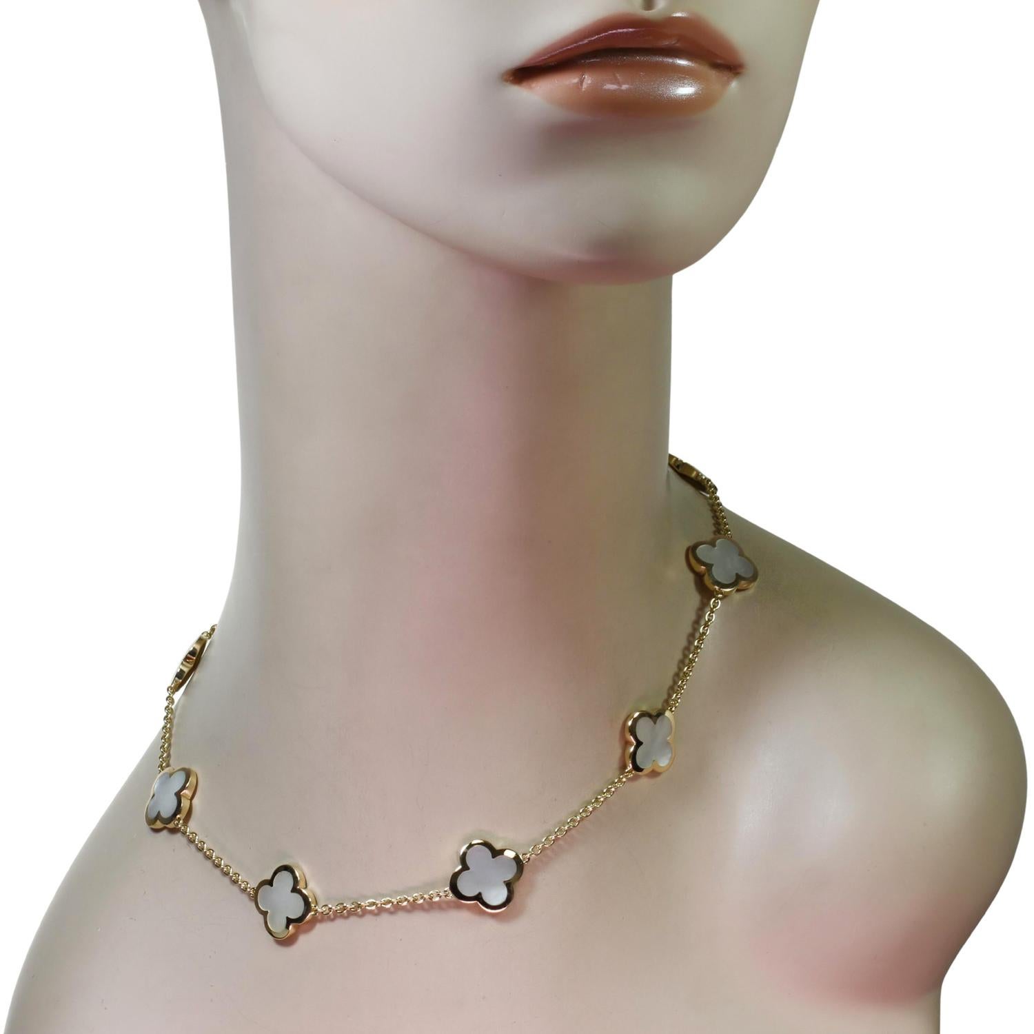 This fabulous Van Cleef & Arpels necklace from the Pure Alhambra collection is crafted in 18k yellow gold and features 9 lucky clover motifs inlaid with mother-of-pearl. Completed with a concealed clasp. Made in France circa 2010s. Measurements: