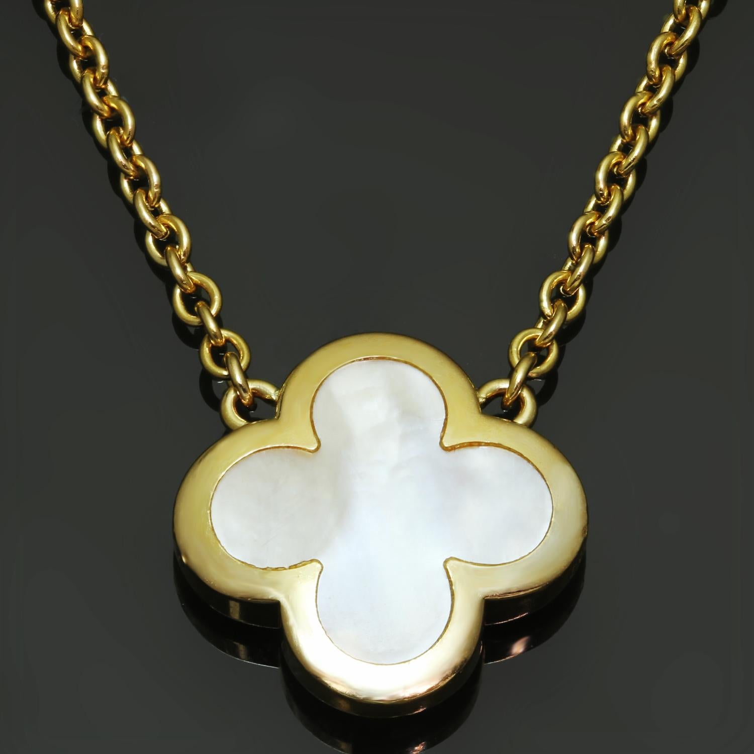 This elegant Van Cleef & Arpels pendant necklace from the pure Alhambra collection features the lucky clover design crafted in 18k yellow gold and set with white mother-of-pearl. Made in France circa 2010s. Excellent condition. Comes with VCA pouch.