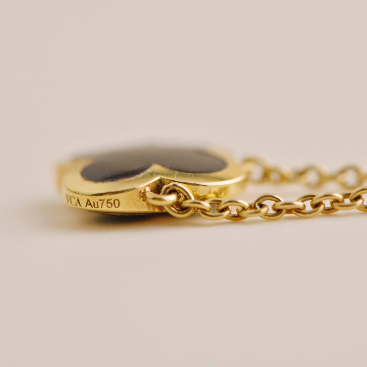black and gold van cleef necklace
