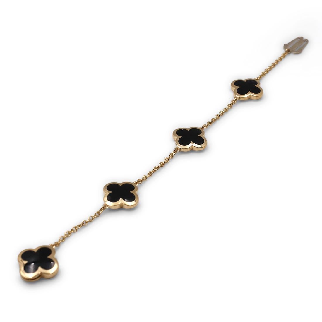 Authentic Van Cleef & Arpels 'Pure Alhambra' bracelet features clover motifs of carved onyx set in smooth, high polished 18 karat gold. The bracelet measures 7 inches in length with a concealed clasp.  Signed VCA, 750, with serial number and