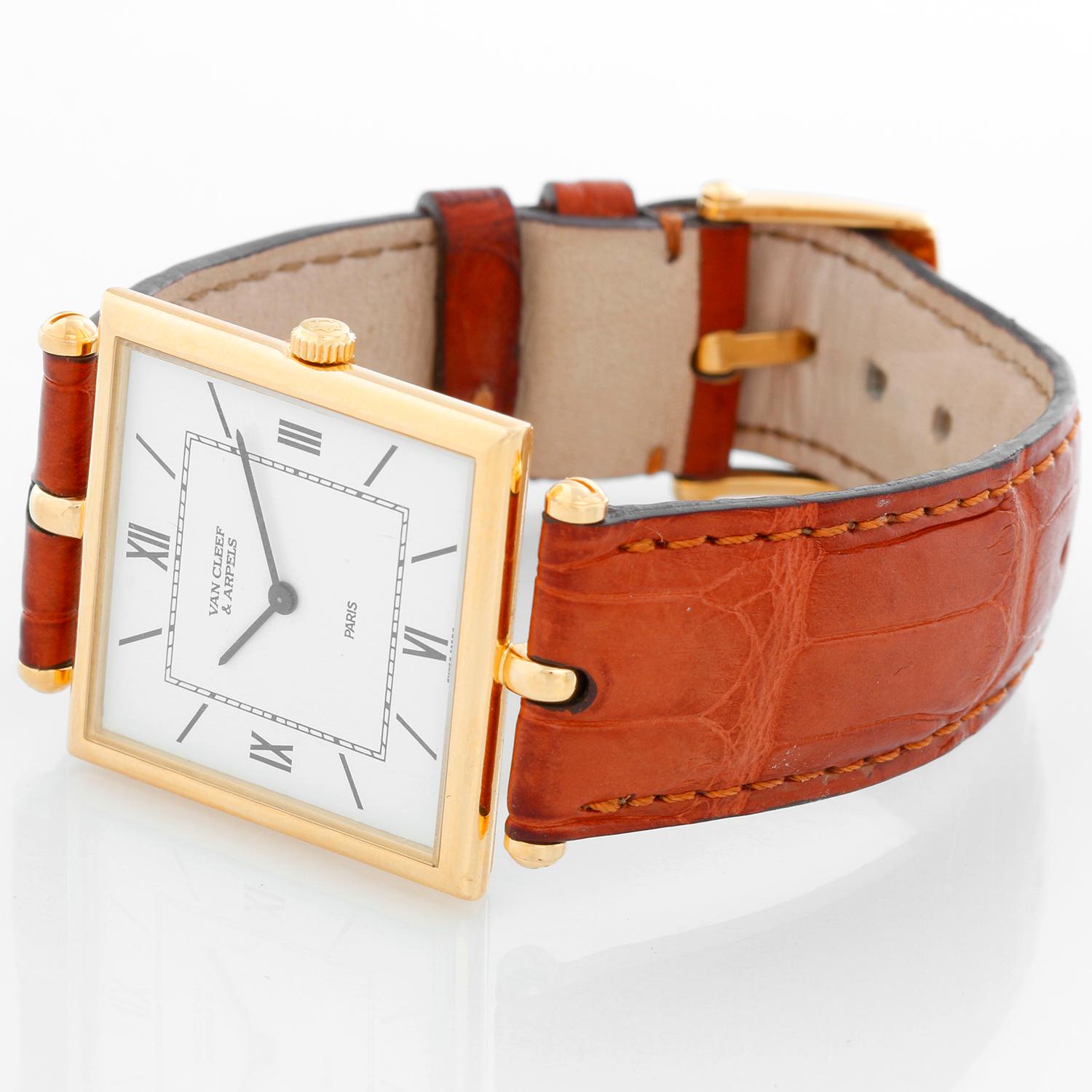 Van Cleef & Arpels Quartz Yellow Gold Oversize Ladies Watch - Quartz. 18K Yellow gold case ( 28 mm). White dial with Roman and stick hour markers. Brown leather Van Cleef & Arpels strap band with 18K Yellow gold V & A tang buckle. Pre-owned with Van