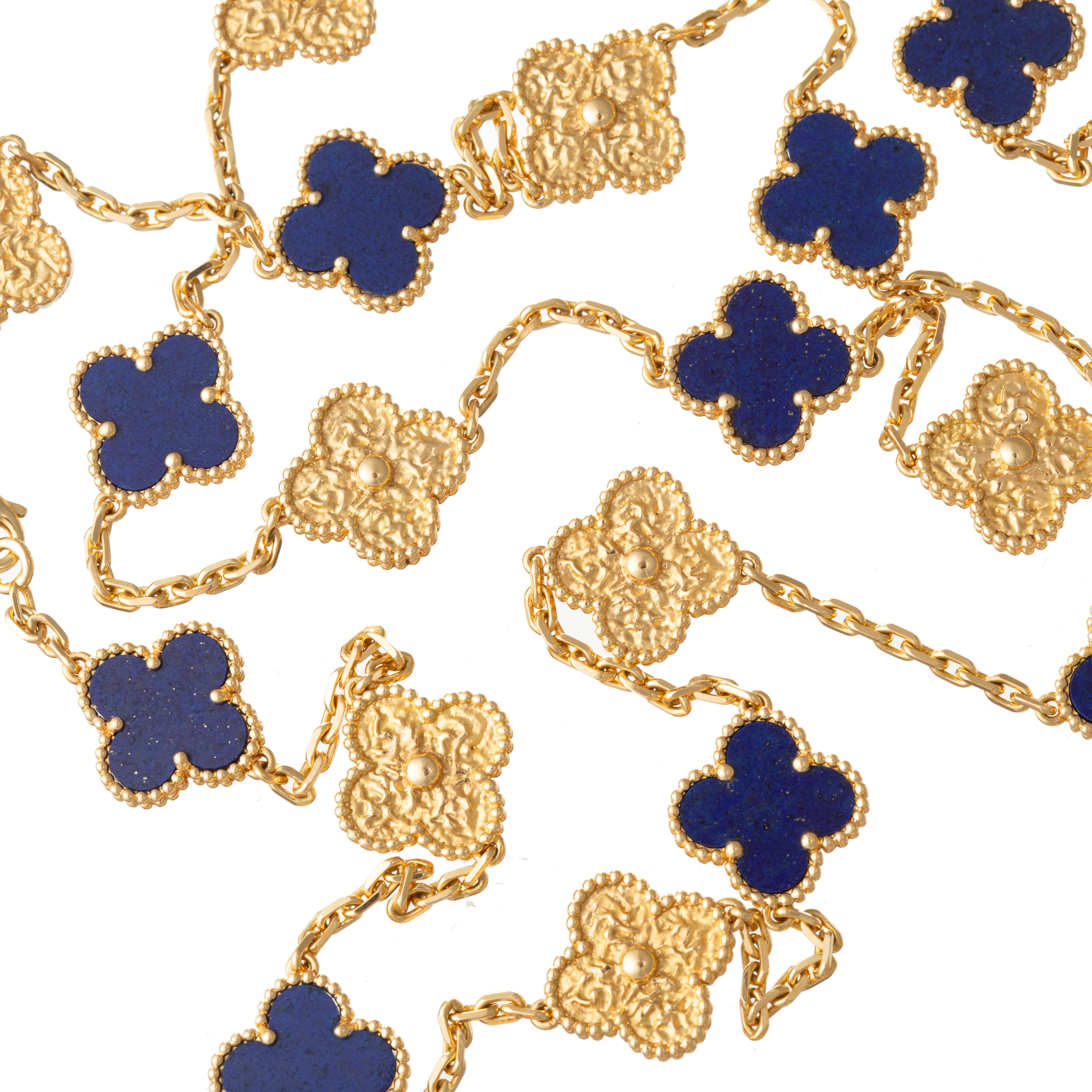 Rare pair of limited edition Vintage Alhambra 18 karat yellow gold and lapis lazuli necklaces by Van Cleef & Arpels.  Each necklace measures 16