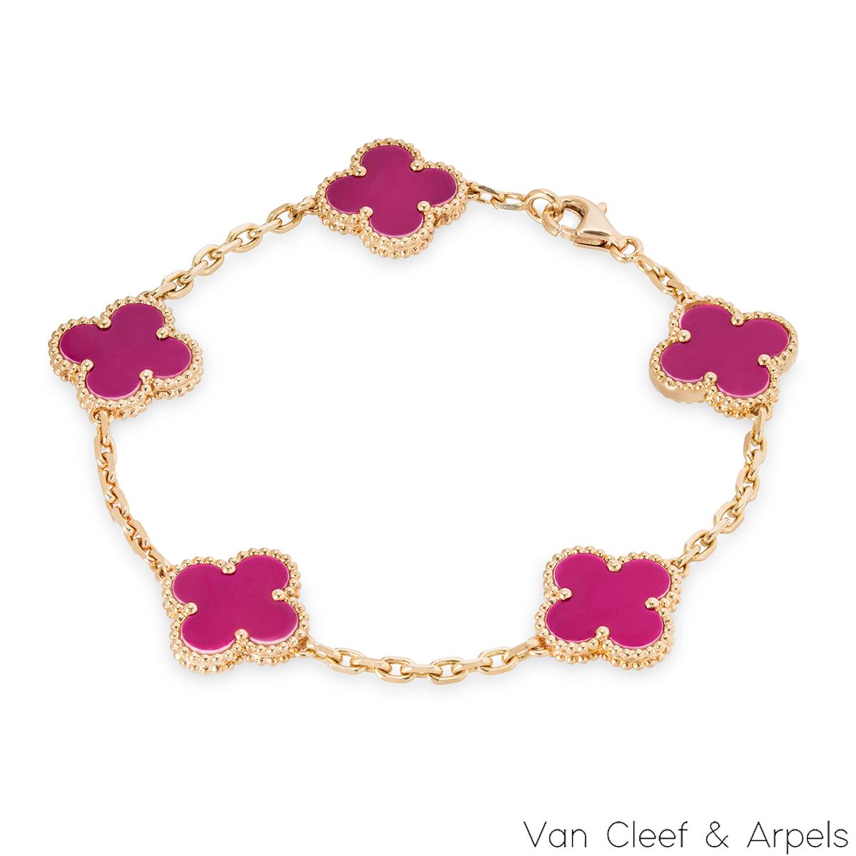 A gorgeous 18k rose gold porcelain bracelet by Van Cleef & Arpels from the Vintage Alhambra collection. The bracelet features 5 iconic 4 leaf clover motifs, each set with a beaded edge and a raspberry pink sèvres porcelain inlay, set throughout the