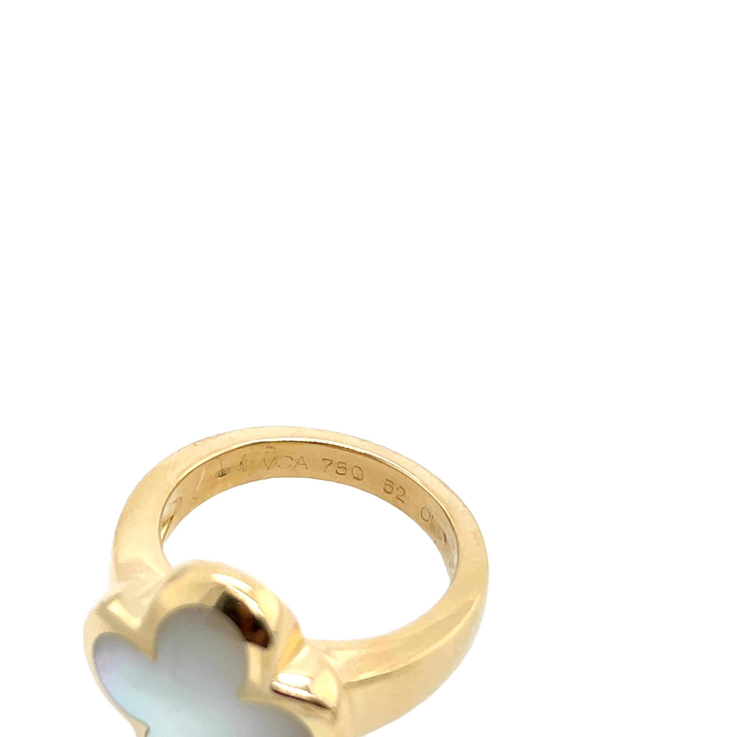 This Van Cleef & Arpels Pure Alhambra ring is a masterpiece, featuring the iconic Alhambra clover motif crafted from natural shell and set in 18ct yellow gold. The delicate design radiates elegance, making it a timeless addition to any jewellery