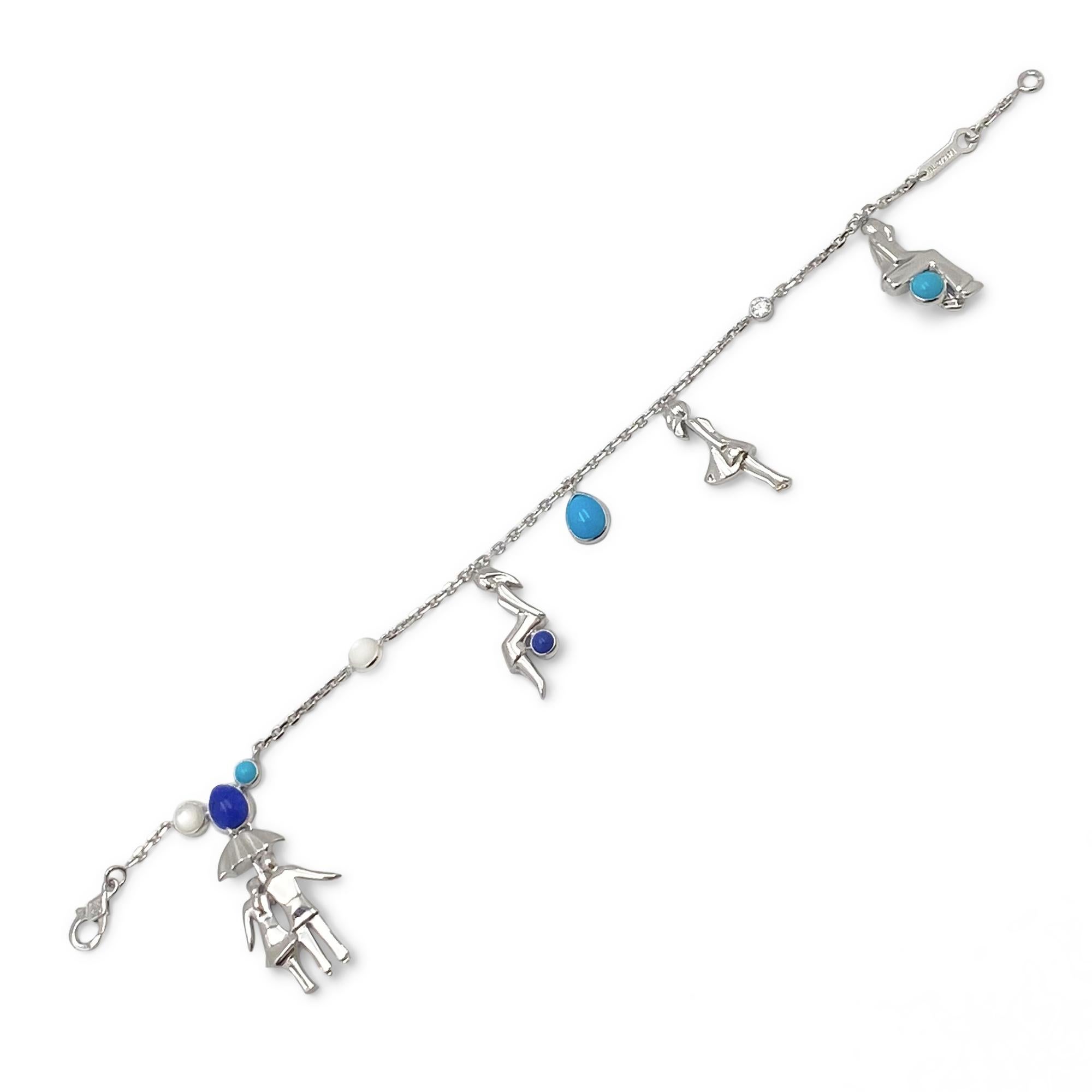 Authentic Van Cleef & Arpels Romance à Paris bracelet crafted in 18 karat white gold.  Scenes of young love come to life in charms of white gold accented by cabochons of turquoise, moonstone, and lapis lazuli with a single round brilliant diamond of