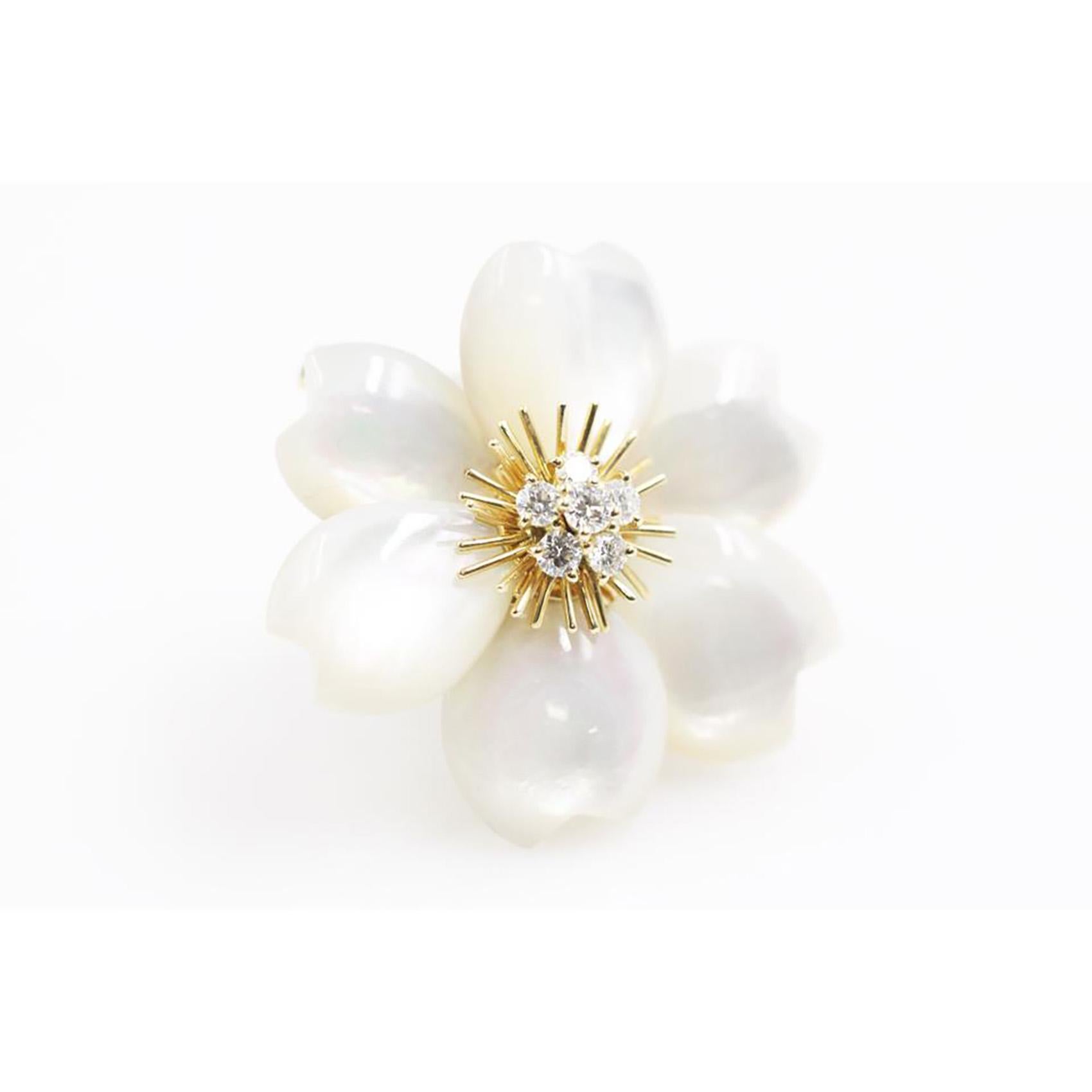 Designer: Van Cleef & Arpels
Collection: Rose de Noel
Metal: Yellow Gold
Metal Purity: 18k
Stones: 6 Mother of Pearl Stones , 6 Round Brilliant Cut Diamonds (DEF, IF to VVS = 0.48 ct)

Since the 1970s, Van Cleef & Arpels has devoted a jewelry