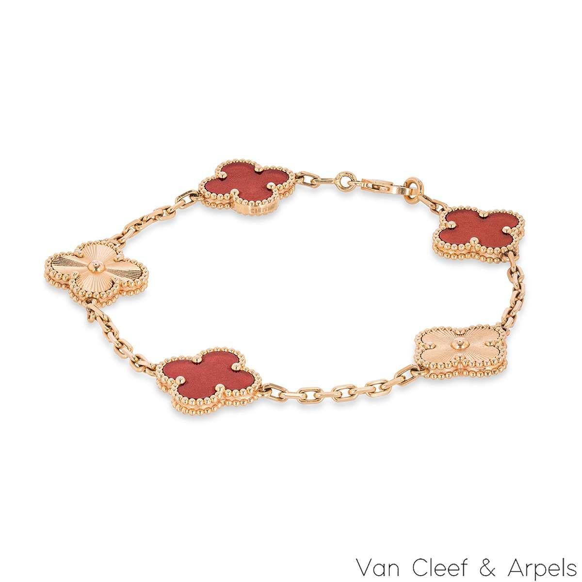 An 18k rose gold, carnelian and guilloche bracelet from the Vintage Alhambra collection by Van Cleef and Arpels. The bracelet consists of 5 alternating iconic clover motifs, 3 are set with carnelian inlays and the other 2 feature guilloche inlays.