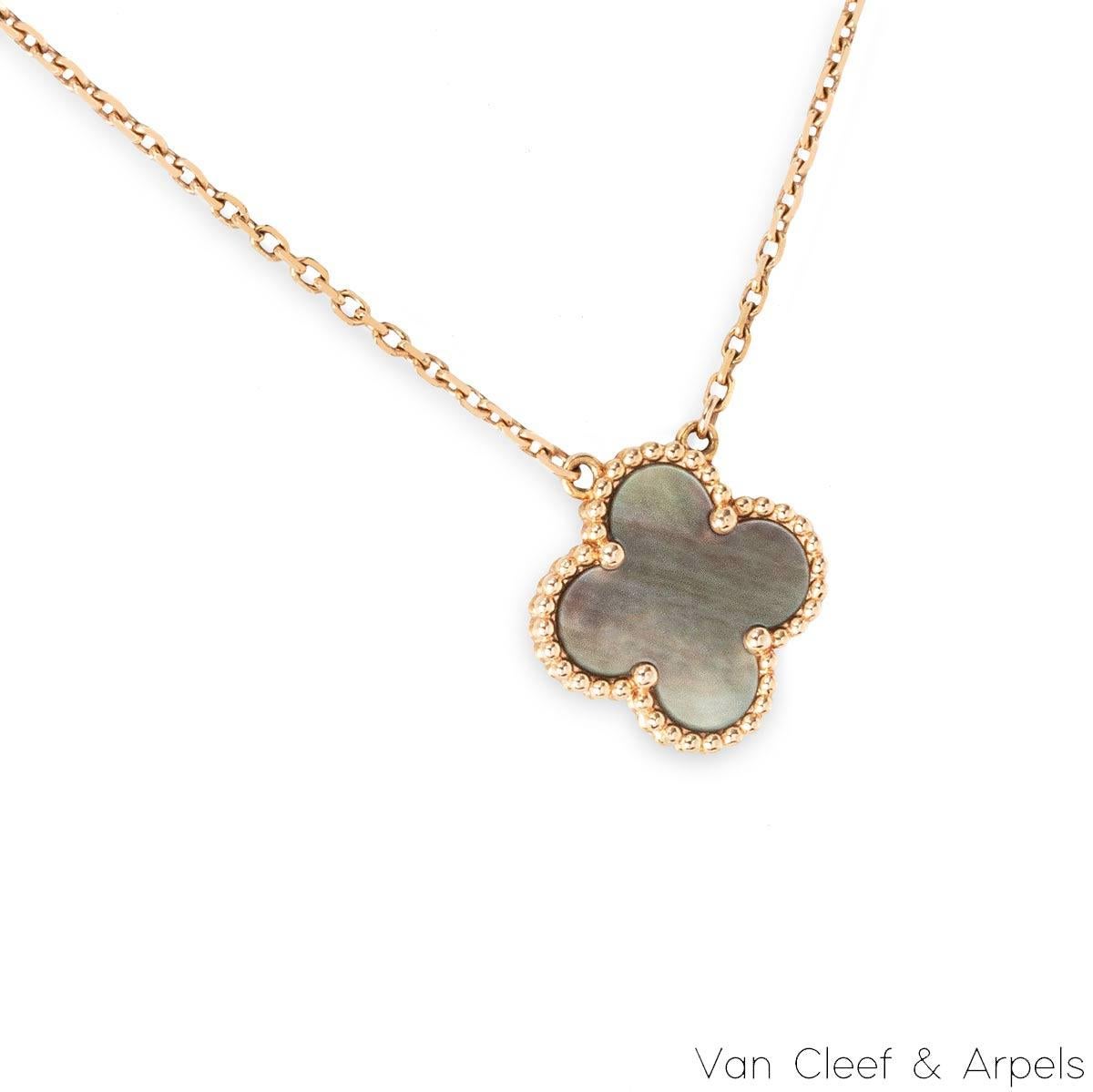An 18k rose gold Van Cleef & Arpels necklace from the Vintage Alhambra collection. The necklace comprises of the iconic Alhambra 4 leaf clover motif with a grey mother of pearl inlay, complemented with a beaded edge.The necklace features a 16.5 inch