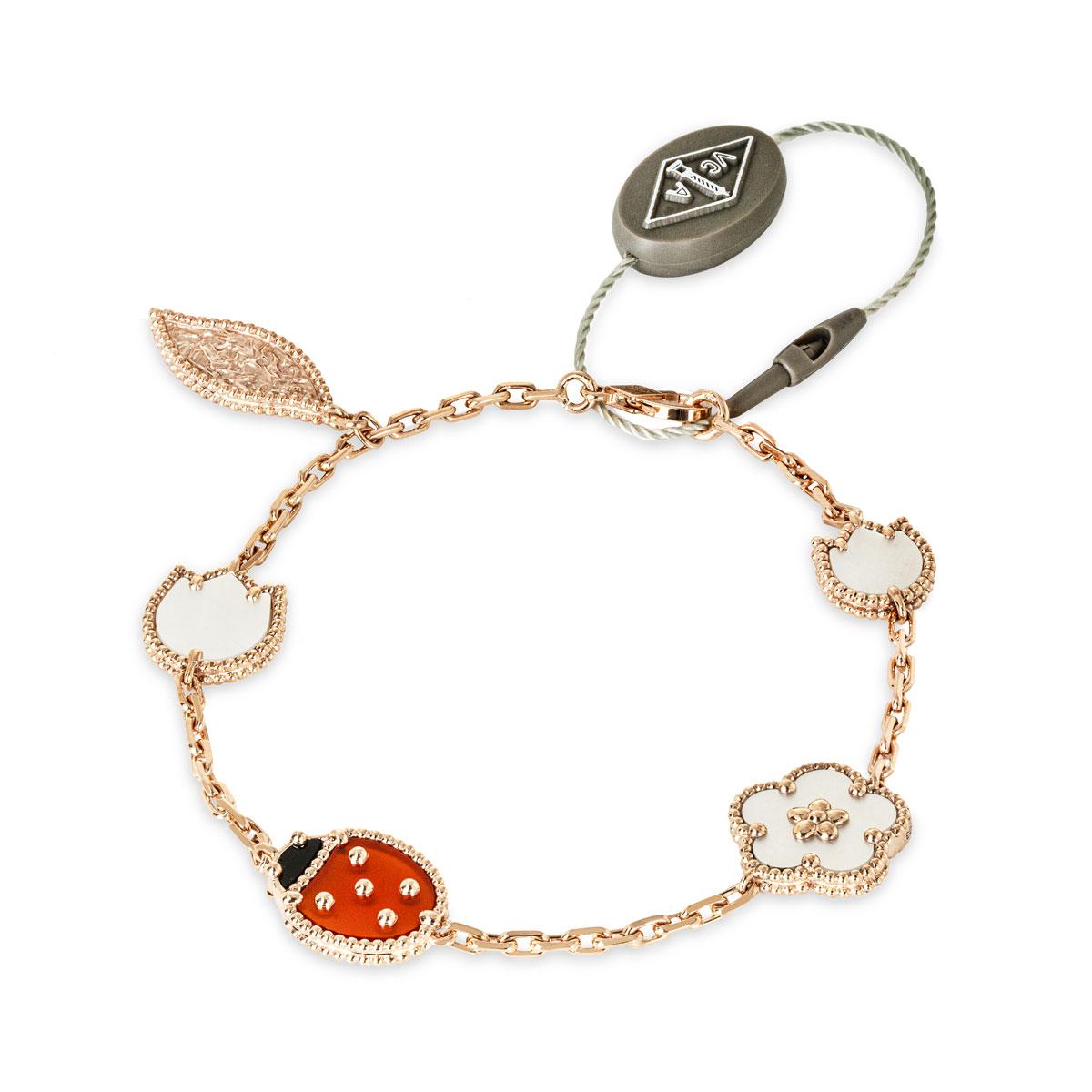 A lovely 18k rose gold, Lucky Alhambra bracelet by Van Cleef & Arpels from the Spring collection. The bracelet features a carnelian and onyx ladybug motif, a single rose gold leaf motif, and finally 3 mother of pearl floral motifs. Measuring 7.3