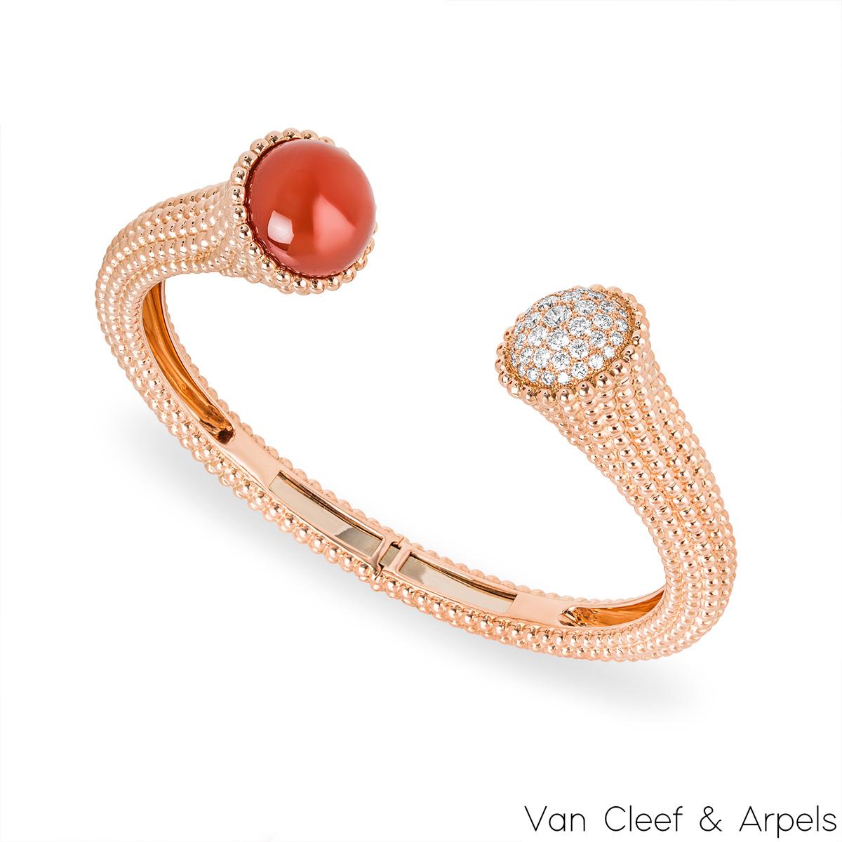 A stunning 18k rose gold diamond and carnelian bracelet by Van Cleef & Arpels from the Perlée Couleurs collection. The cuff style bracelet is adorned with a beaded design throughout and finishes with one diamond set termination and one carnelian