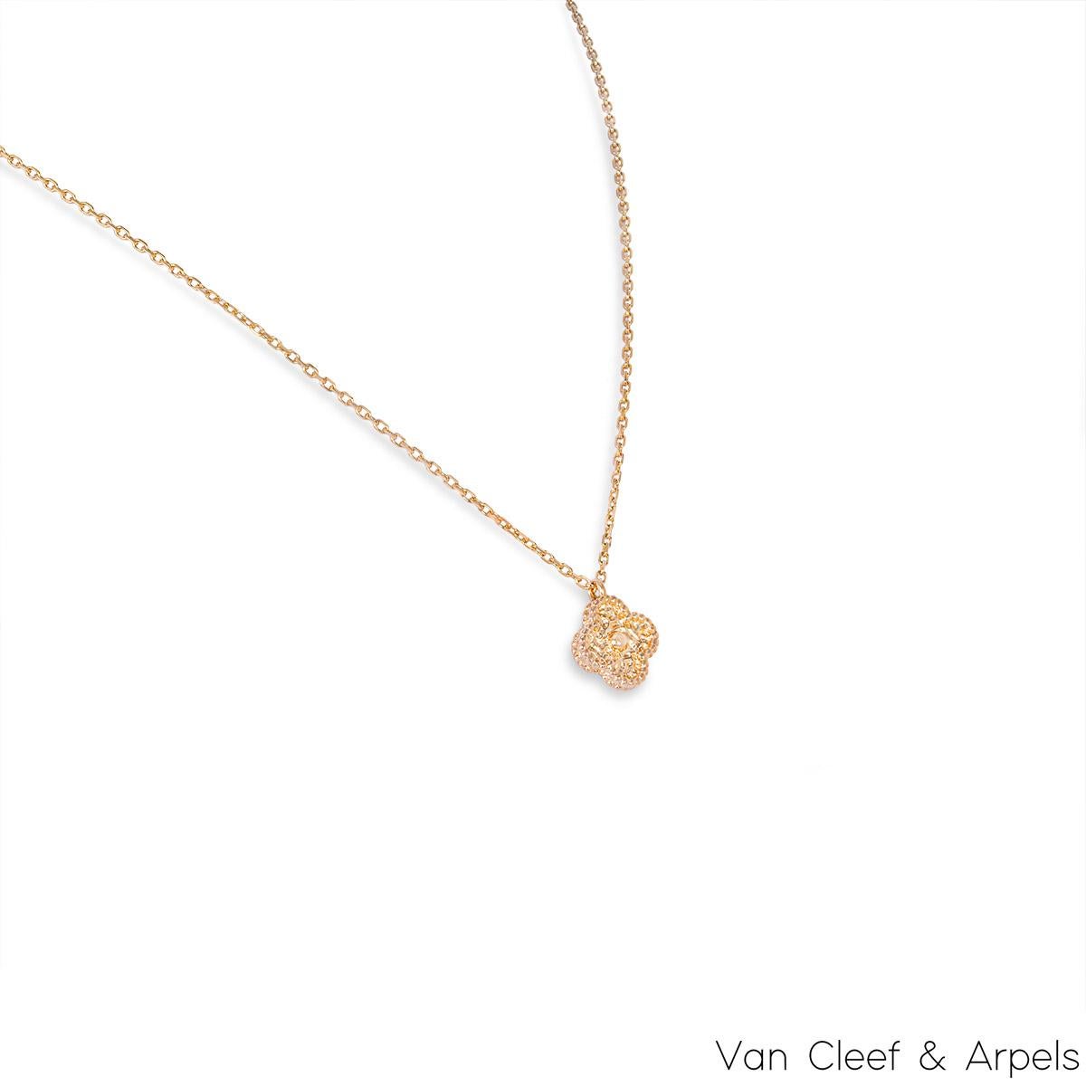 A timeless 18k rose gold pendant by Van Cleef & Arpels from the Sweet Alhambra collection. The pendant features a 4 leaf clover motif set with a textured pattern and complemented by a beaded outer edge. The motif measures 0.9cm in width and suspends