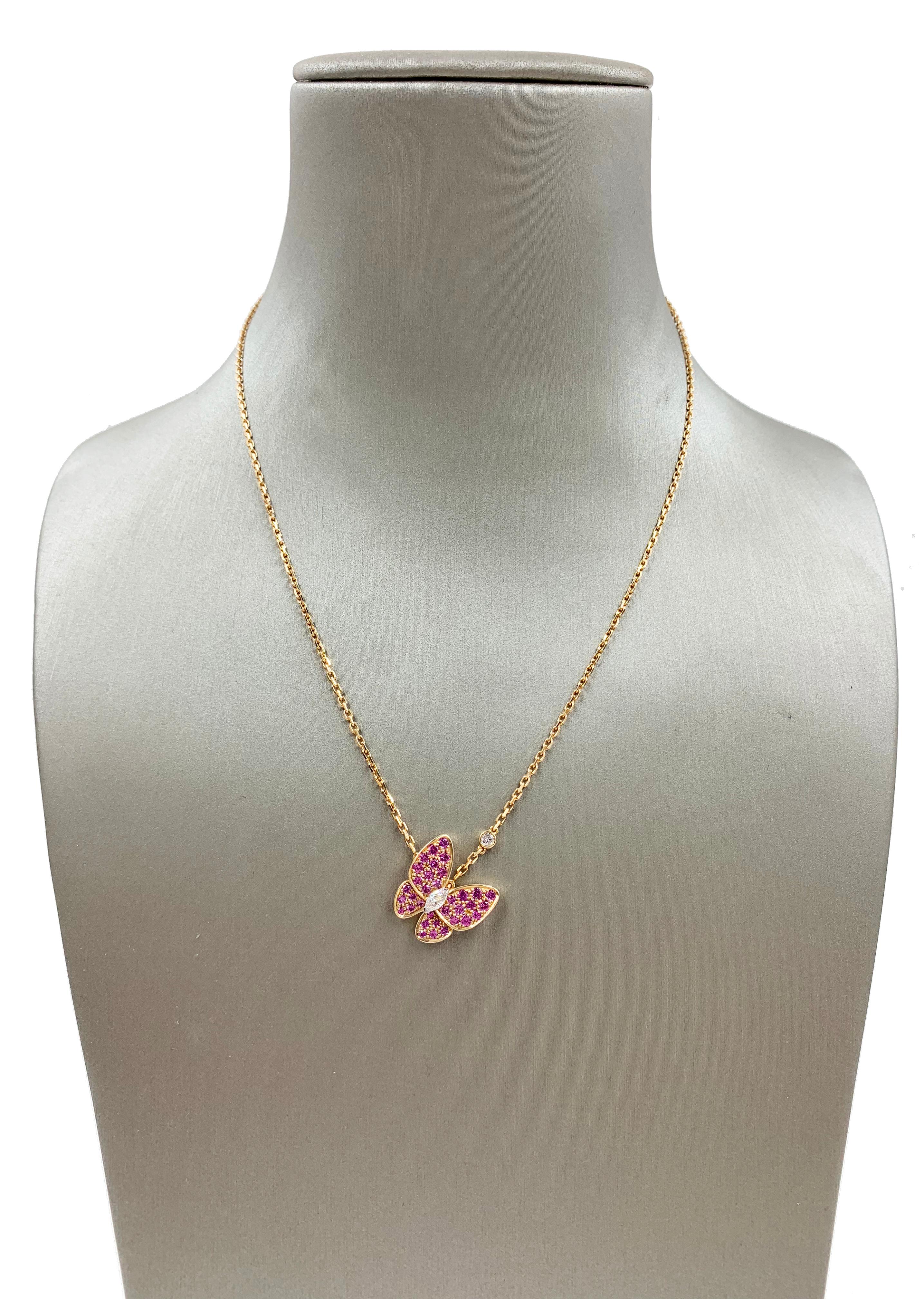 A beautiful Van Cleef & Arpels Two Butterfly pendant in rose gold set with round pink sapphires and white gold, round and marquise-cut diamonds. Diamond: 2 stones, 0.2 carats. Sapphire: 34 stones, 0.88 carats. Diamond quality DEF, IF to VVS. REF: