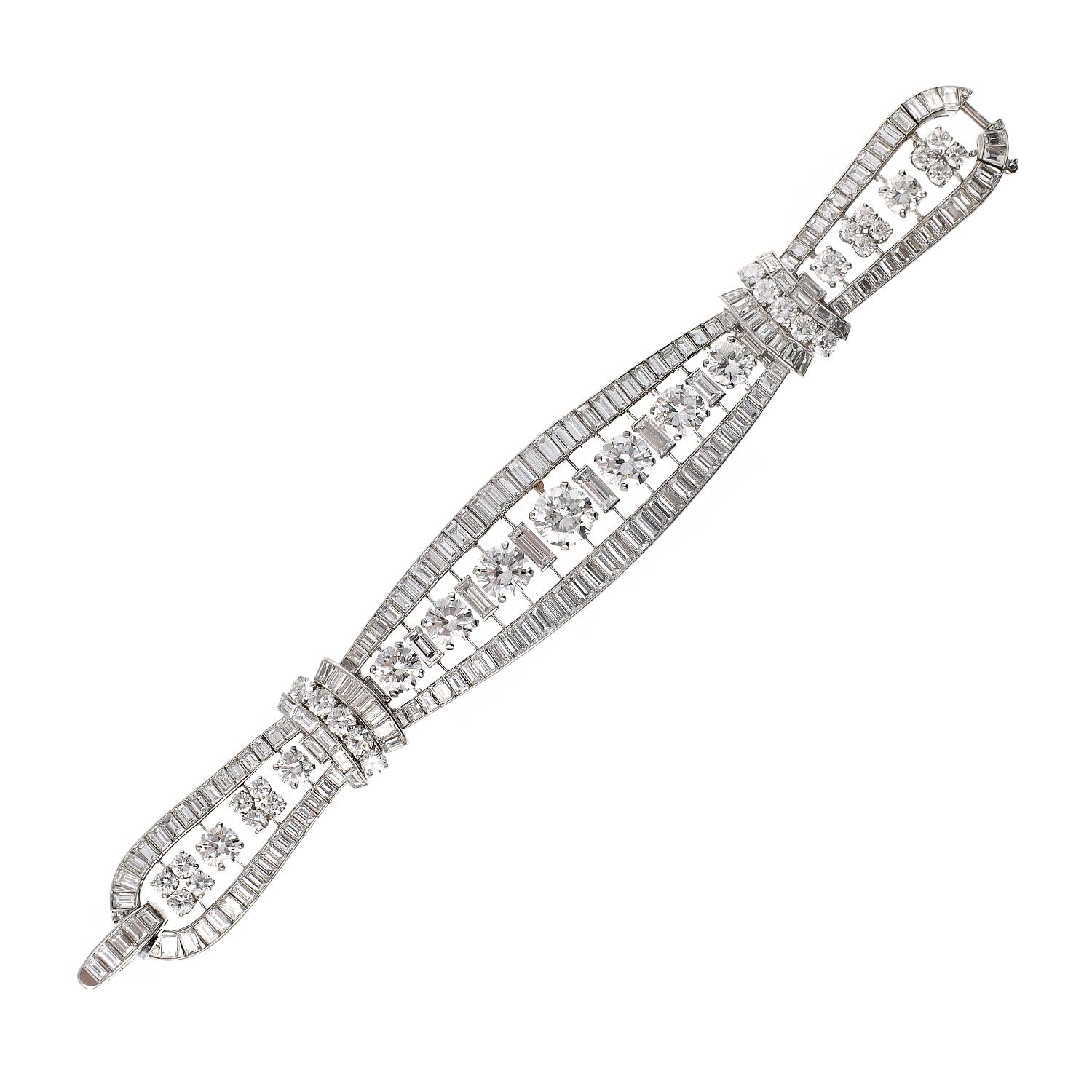 AN CLEEf & ARPELS Round & Baguette Diamond Bracelet
A flexible band set with round brilliant-cut and baguette diamonds, mounted in platinum, signed Van Cleef & Arpels.
Total length is approx. 7″ by 0.50-1.0″ wide
Total diamond carat weight approx.