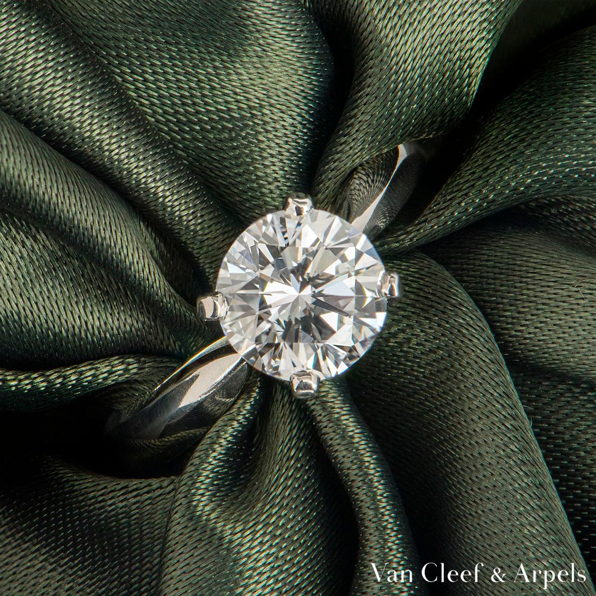 A beautiful platinum diamond ring by Van Cleef & Arpels from the Bonheur collection. The ring comprises of a round brilliant cut diamond in a four claw setting with a weight of 1.64ct, E colour and VVS2 clarity. The ring is a size UK K/US 5/EU 50