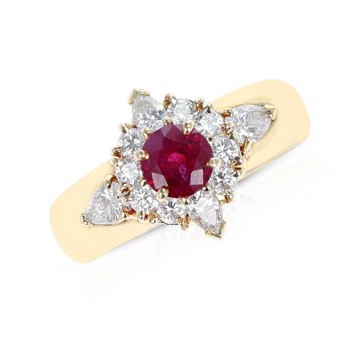 Van Cleef & Arpels Round Ruby Ring with Diamonds made in 18 Karat Yellow Gold. The diamonds are pear and round shapes on the ring. The ring size is US 6. The total weight of the ring is 9.82 grams. 