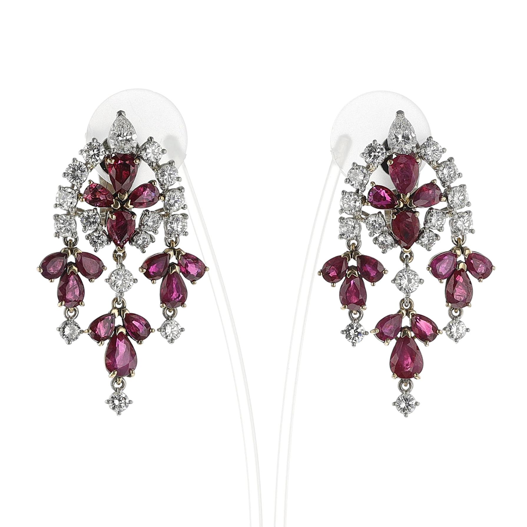 A pair of exquisite Van Cleef & Arpels Ruby and Diamond Chandelier Earrings with a combination of pear-shaped rubies and pear-shaped and round diamonds. The rubies weigh appx. 15 carats and the diamonds weigh appx. 5.00 carats of F-G color and VS