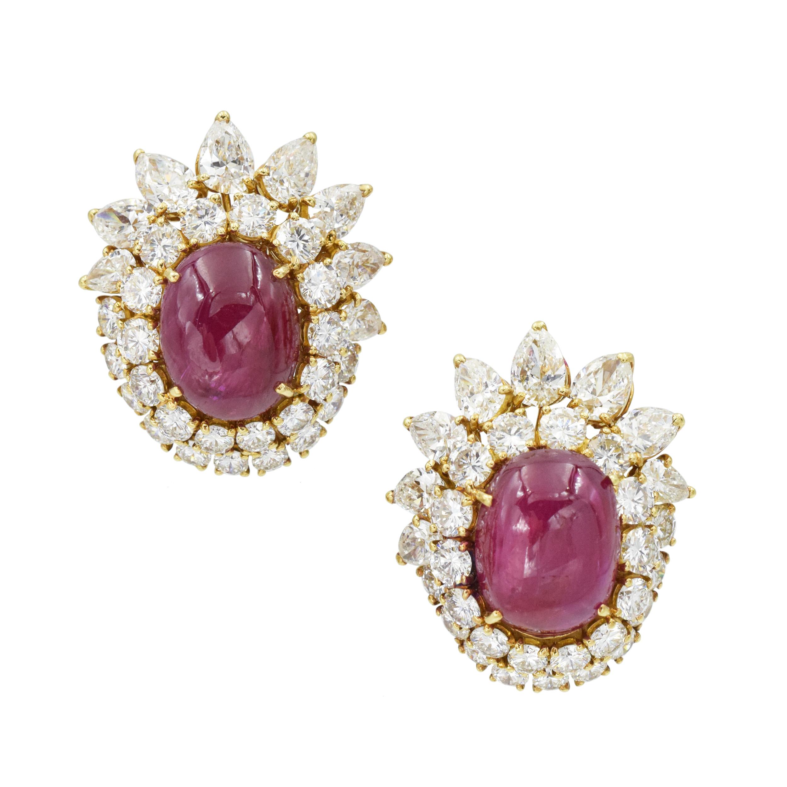 Vintage, Van Cleef And Arpels Ruby & Diamond Earrings and Ring Set In 18k Yellow Gold. Circa 1975.
  the earrings are set with 2 oval cabochon cut rubies measuring 13.8 x 10.8 x 6.0 mm and 14.3 x 10.9 x 5.5 mm, surrounded with double halo 48 round
