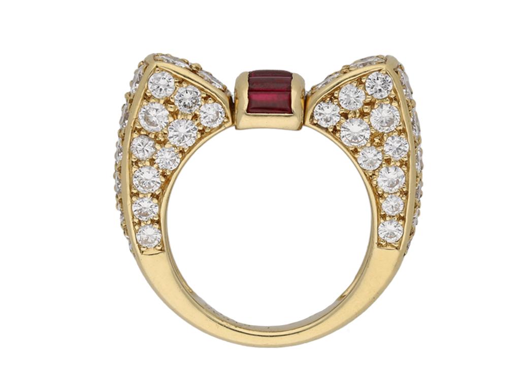 Van Cleef & Arpels ruby and diamond ring. Centrally set with five rectangular tallow cut natural unenhanced rubies in open back channel settings with a combined approximate weight of 0.90 carats, further adorned with seventy two round brilliant cut