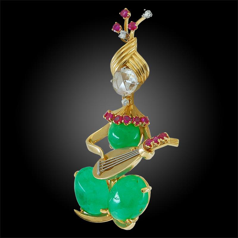18k yellow gold rose cut diamond, ruby and cabochon emerald star player brooch, signed Van Cleef & Arpels.
circa 1940s