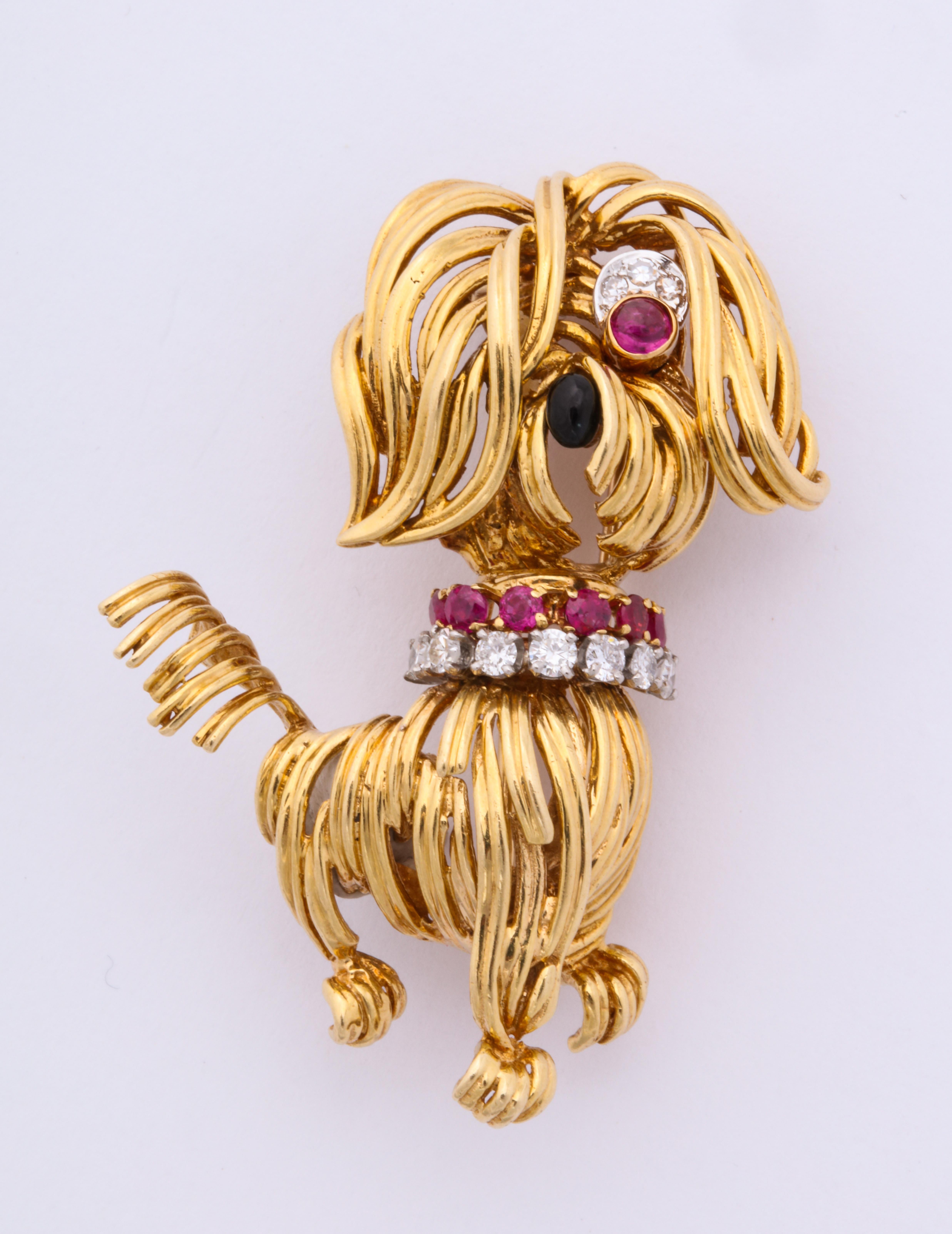 Van Cleef & Arpels 18kt yellow gold, ruby, onyx and diamond dog brooch.
Signed and numbered.
Circa 1964