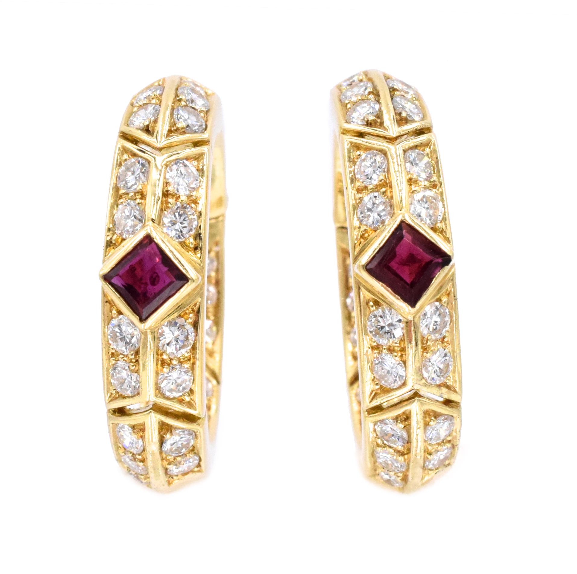 Van Cleef and Arpels Diamond, Ruby, and Gold Hoop Earrings
This pair of hoop earrings have 60 round brilliant cut diamonds with an approximate total weight of 2ct and two square rubies with an approximate total weight of 0.4ct, all set in 18kt