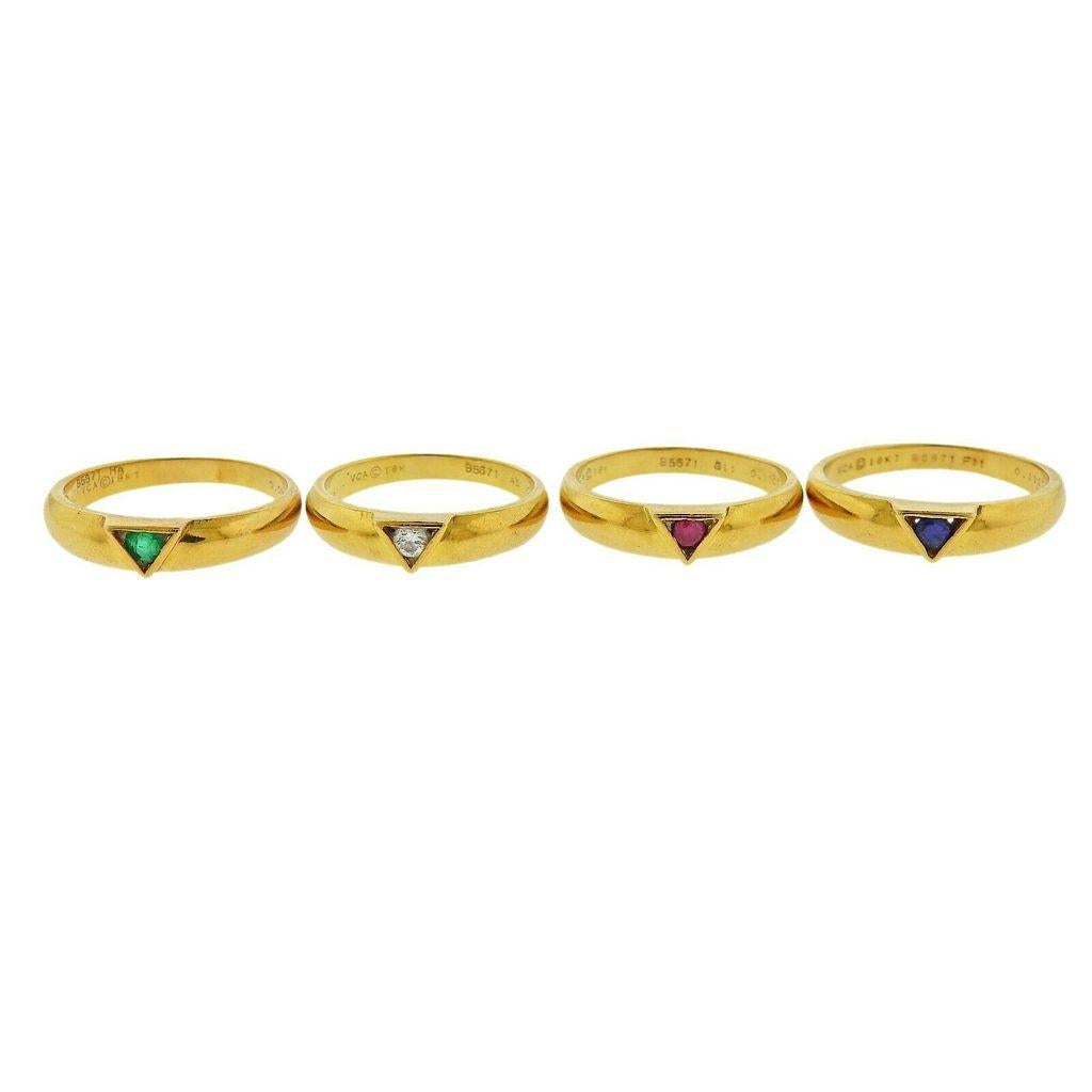 18k yellow gold stackable ring set by Van Cleef & Arpels. Rings feature a single diamond, ruby, sapphire and emerald center stone. Diamond- 0.07ct, Ruby- 0.11ct, Sapphire- 0.11ct, Emerald- 0.09ct. Ring sizes - 6.25 each . Width - 4.4mm (each). 