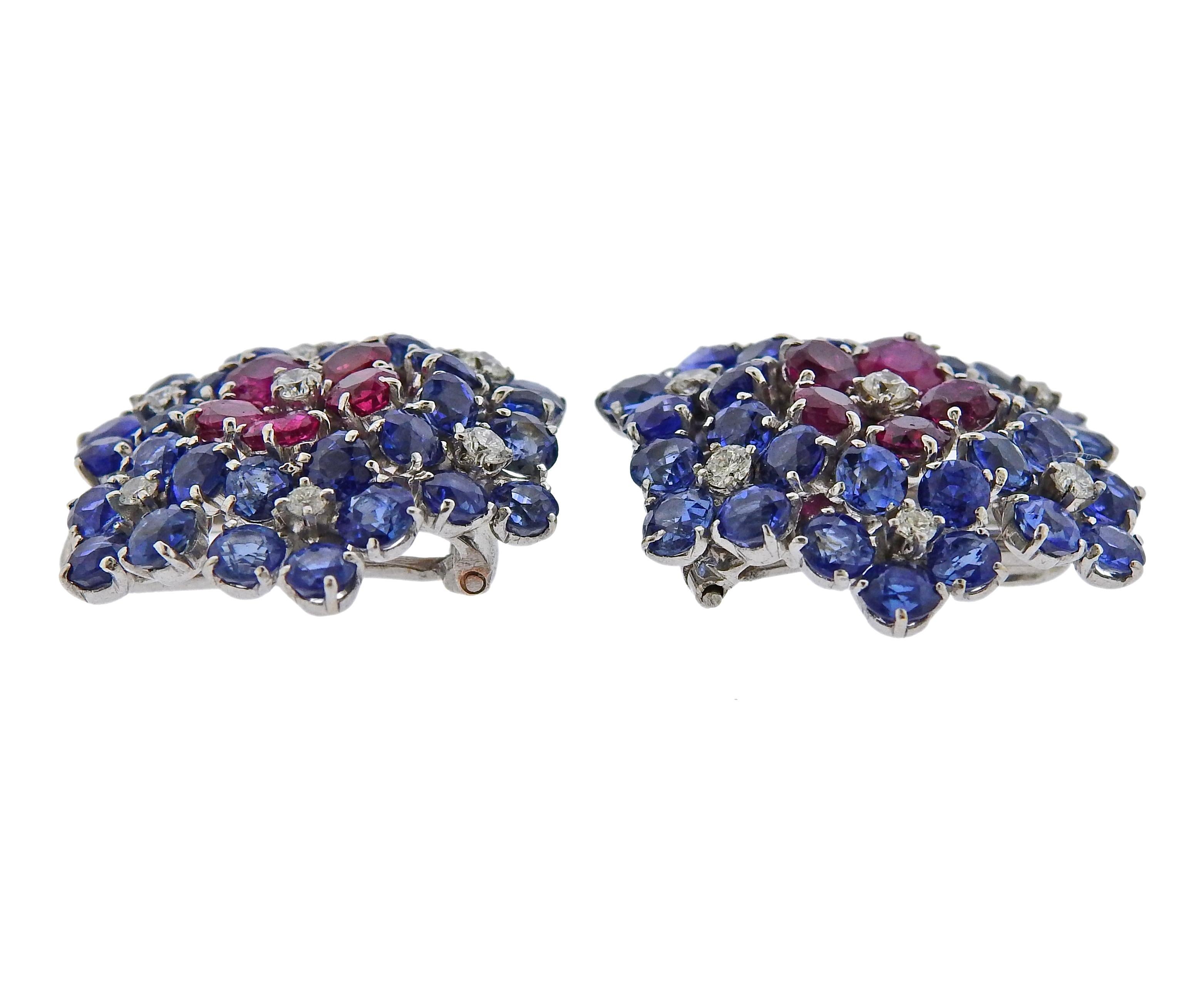 Pair of circa 1940s Van Clef & Arpels rose gold rhodium plated flower earrings, can be worn as clips. Each measures 22mm x 22mm, set with approx. 8.50ctw in blue sapphires, 1.60ctw in rubies and approx. 0.45ctw in diamonds. Marked Van Cleef &