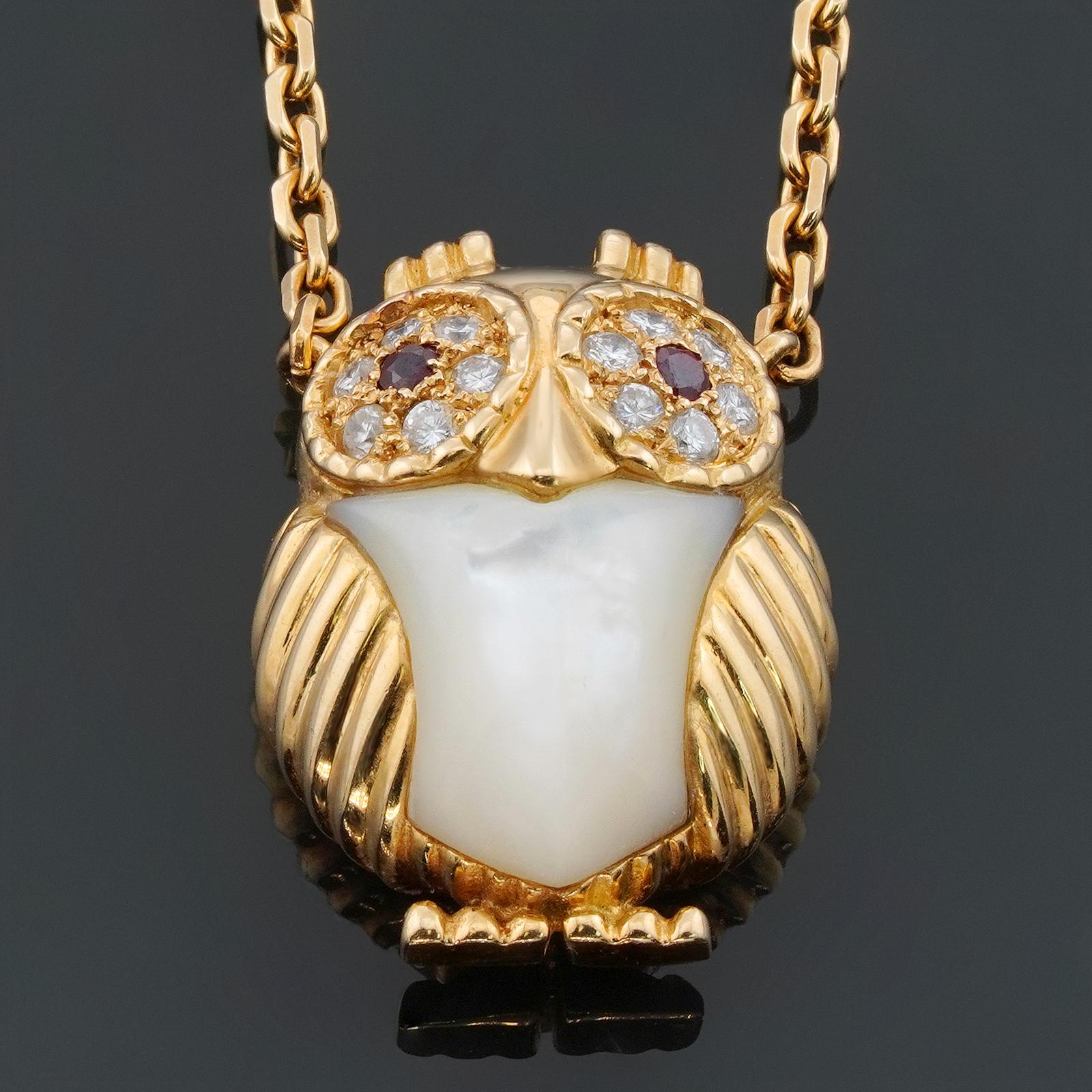 This adorable rare and collectible Van Cleef & Arpels 18k yellow gold necklace features a 15.0mm x 21.0mm owl pendant set with Mother-of-Pearl and brilliant-cut round E-F-G VVS1-VVS2 diamonds weighing an estimated 0.18 carats and round rubies