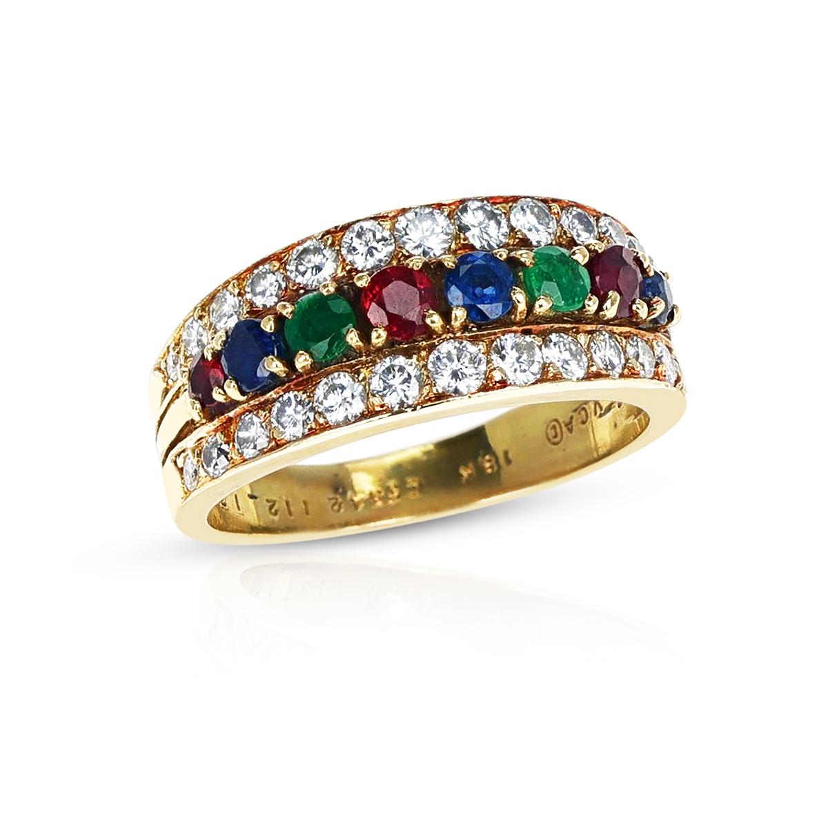 A Van Cleef & Arpels Ruby, Emerald, Sapphire and Diamond Ring made in 18 Karat Yellow Gold. The ring size is US 5.75 and the weight of the ring is 5.10 grams. 
