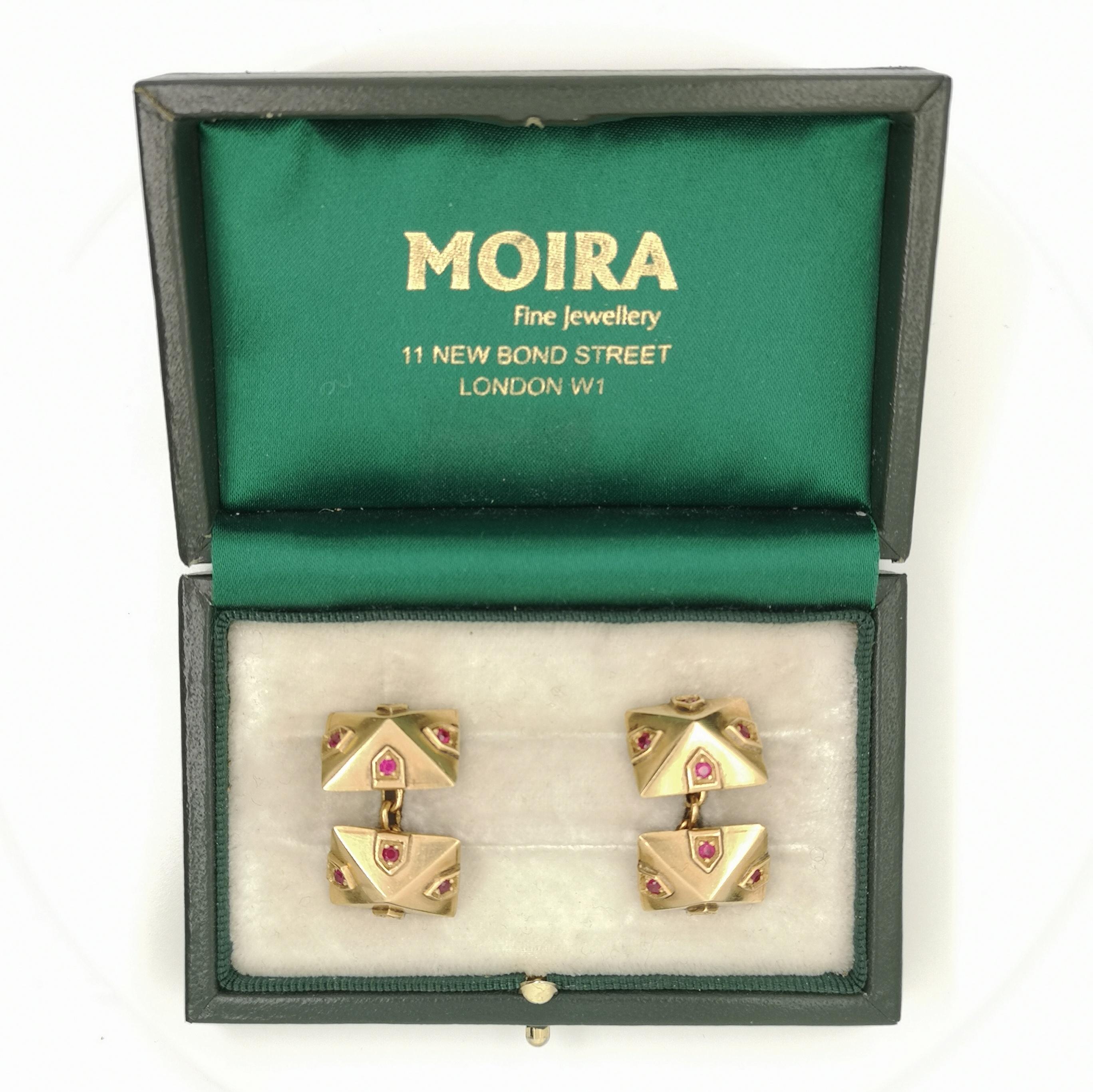 A pair of vintage, Van Cleef & Arpels, gold, double-sided pyramid shaped cufflinks, each face set with four rubies. With chain link fittings. Signed VCA 18K NY. Circa 1960.