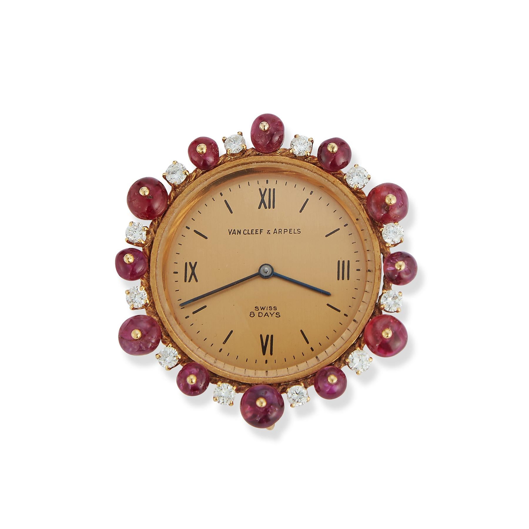Van Cleef & Arpels Ruby Watch Pendant

Features 12 cabochon Rubies and diamonds surrounding the clock.

Dimensions: approximately 1.5 x 1.5 inches