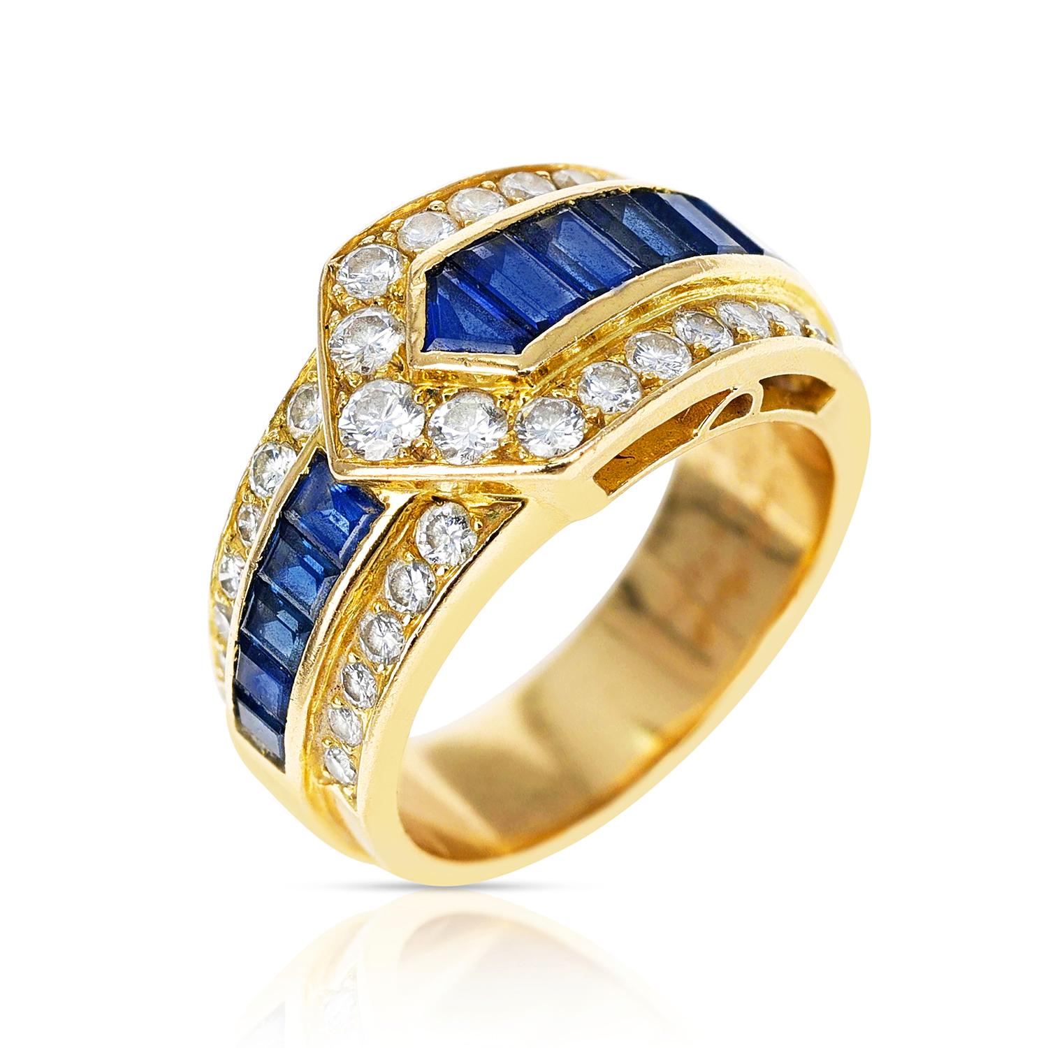 A Van Cleef & Arpels Sapphire and Diamond Arrow Band Ring made in 18 Karat Yellow Gold. The total weight is 9.22 grams. The ring size is US 6.50. 