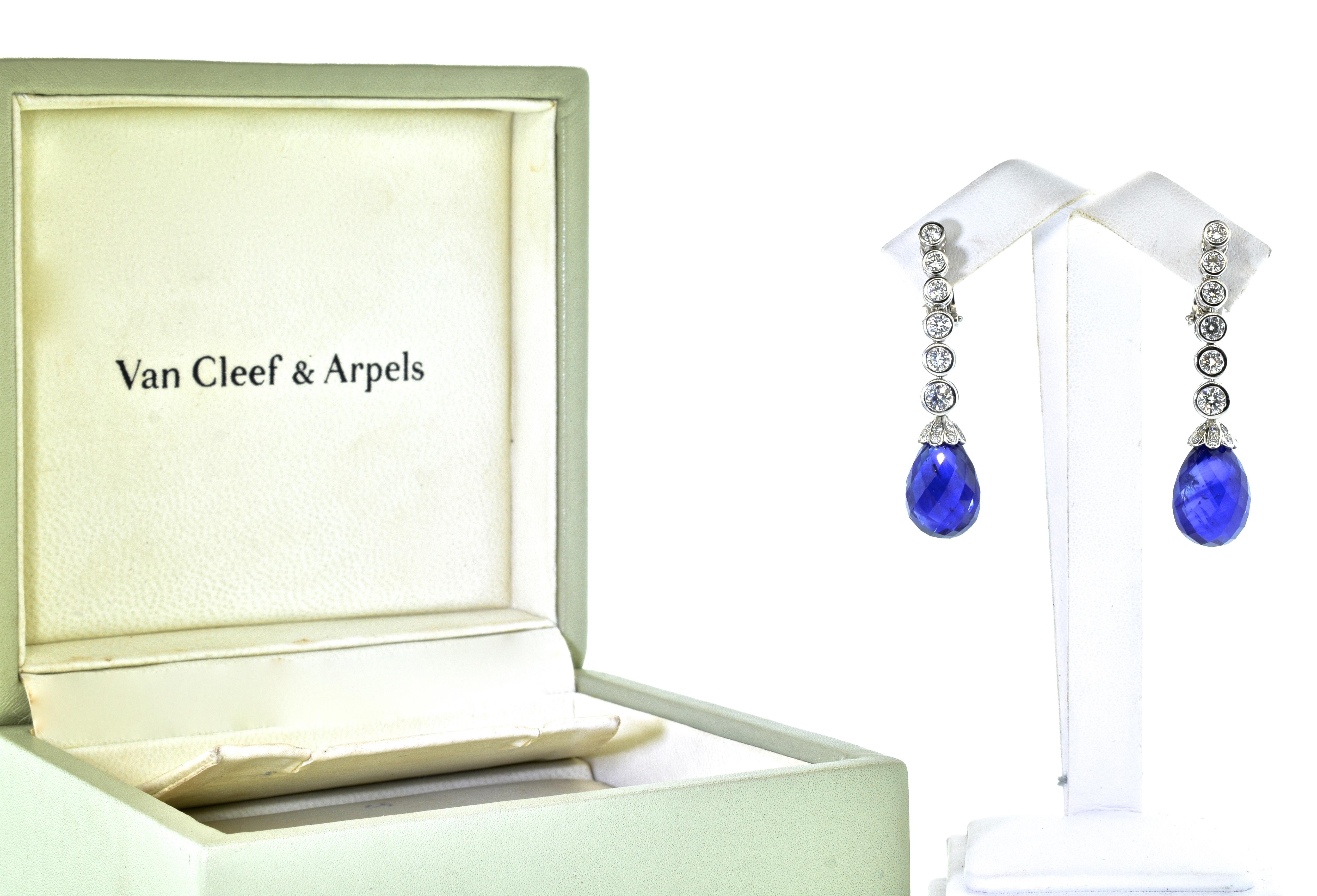 Van Cleef & Arpels earrings possessing two fine faceted briolette natural bright blue sapphires weighing 27.4 cts.  They are well matched and well cut and display a pure bright blue color.  There are approximately 2.5 cts. of fine collection quality