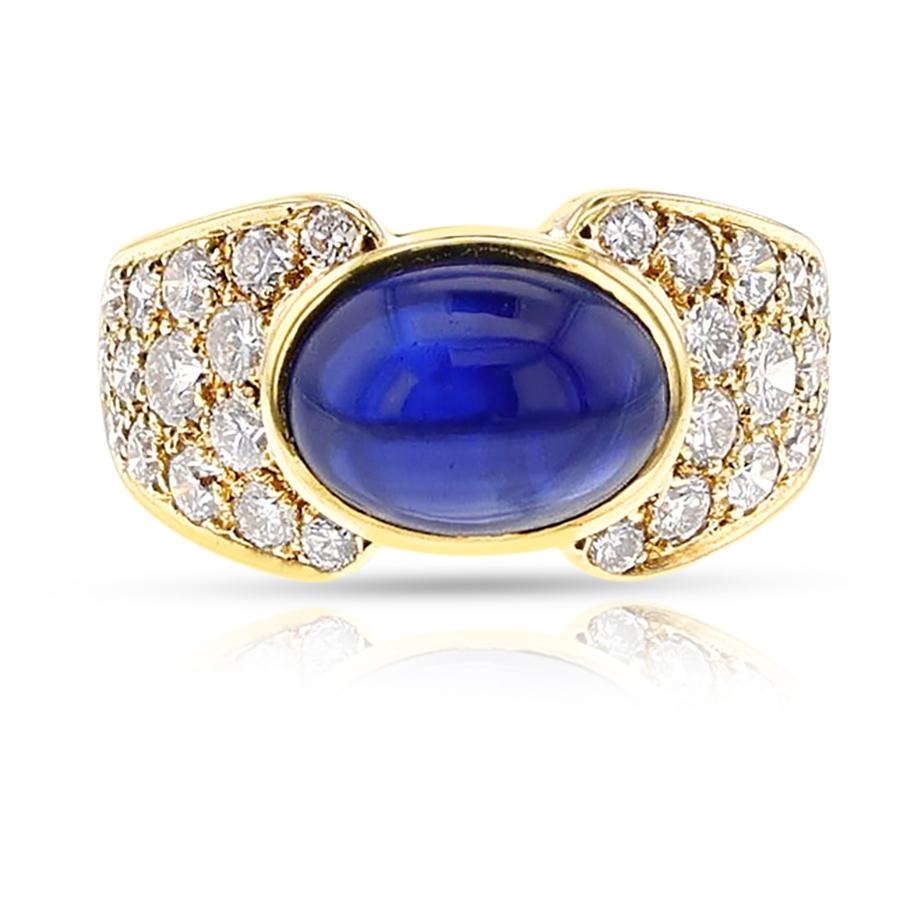 A Van Cleef & Arpels Sapphire Cabochon and Diamond Ring made in 18k yellow gold.   The sapphire cabochon measures 10.5 mm x 7.5 mm. The total diamonds weight is 2.2 carats, F, VS1 clarity. The ring size is US 6. The ring weighs 7.95 grams.