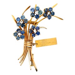 Van Cleef & Arpels Broche myosotis saphir diamant en or jaune 18 carats