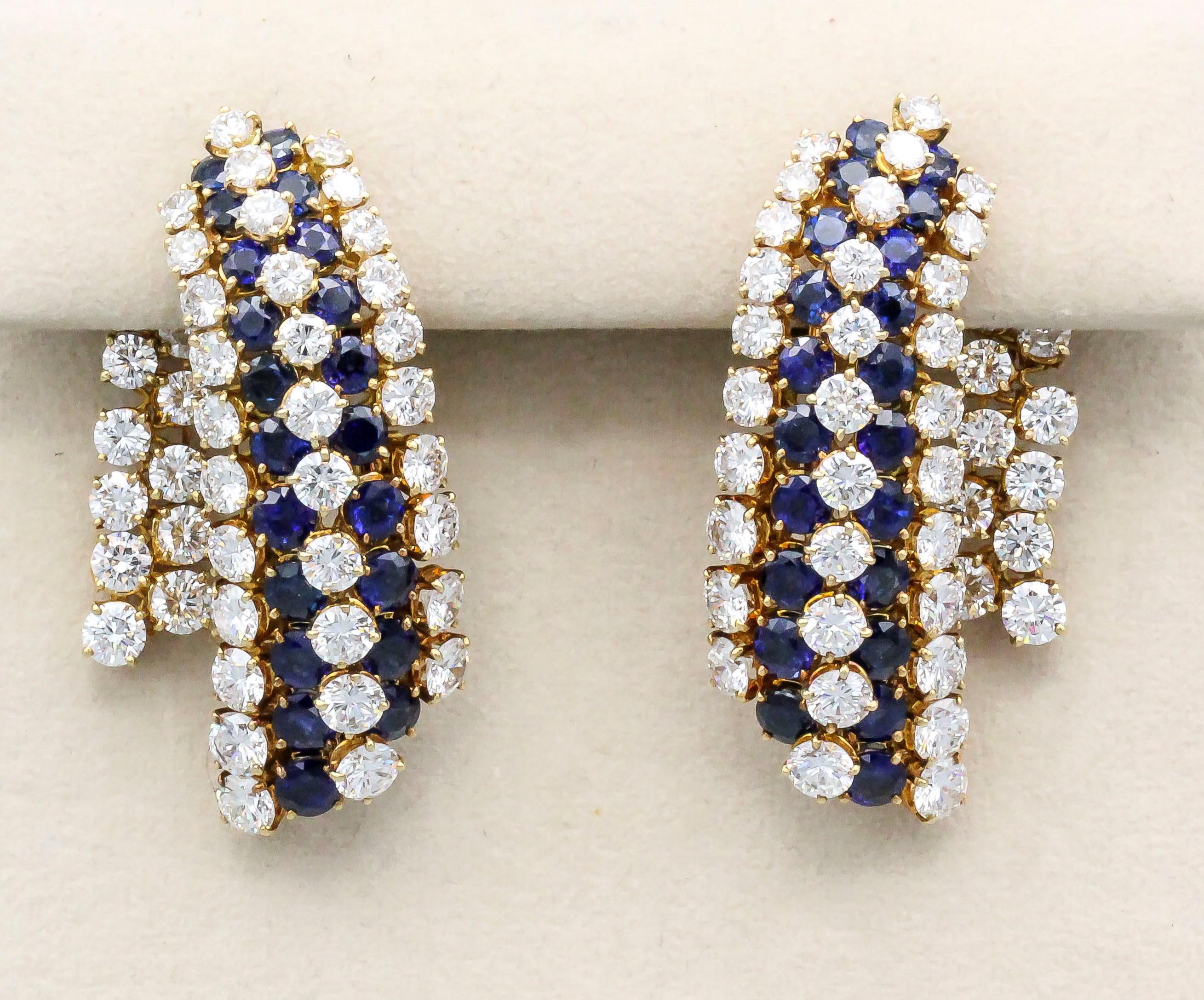 Impressive blue sapphire, diamond and 18K yellow gold ear pendant earrings by Van Cleef & Arpels.  They feature rich blue sapphires approx. 11.00cts, and very high grade round brilliant cut diamonds, approx. 14.90 cts total weight.

Hallmarks: Van