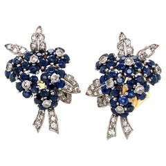 Van Cleef
Arpels Sapphire, Diamond and Platinum/Gold Flower Earrings