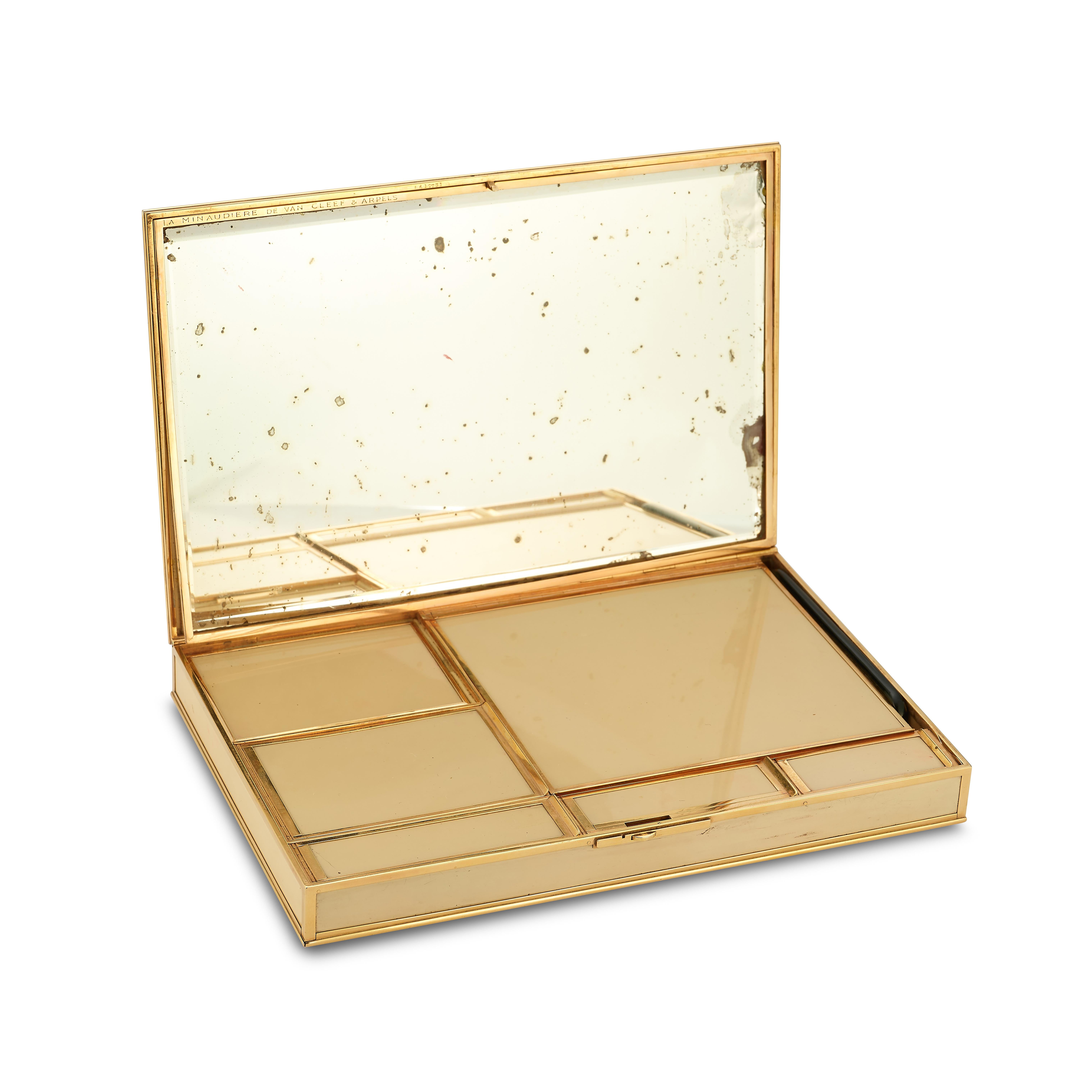 Van Cleef & Arpels Sapphire Gold Diamond and Bakelite Minaudière Makeup Box

Made of Bakelite and 18 karat yellow gold, set with 31 cabochon sapphires and 13 square cut diamonds. The inside contains several different sized compartments, a compact