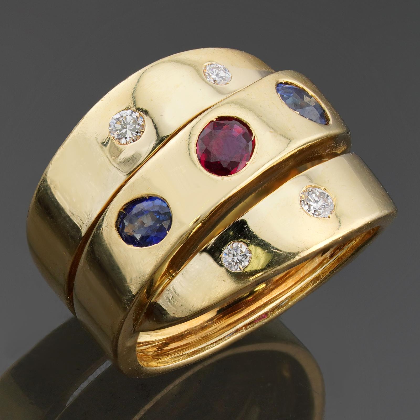 This fabulous vintage Van Cleef & Arpels ring features a wide band design crafted in 18k yellow gold and bezel-set with blue sapphire, red rubies, and diamonds. Made in France circa 1980s. Measurements: 0.59