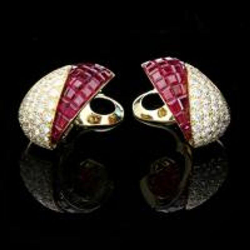 A stylish pair of 'Sertie Invisible' gold, ruby and diamond asymmetric clip earrings Van Cleef & Arpels, circa 1980s Paris, France made for the New York market Setting 18ct yellow gold with French assay marks and makers signature & numbers Gemstones