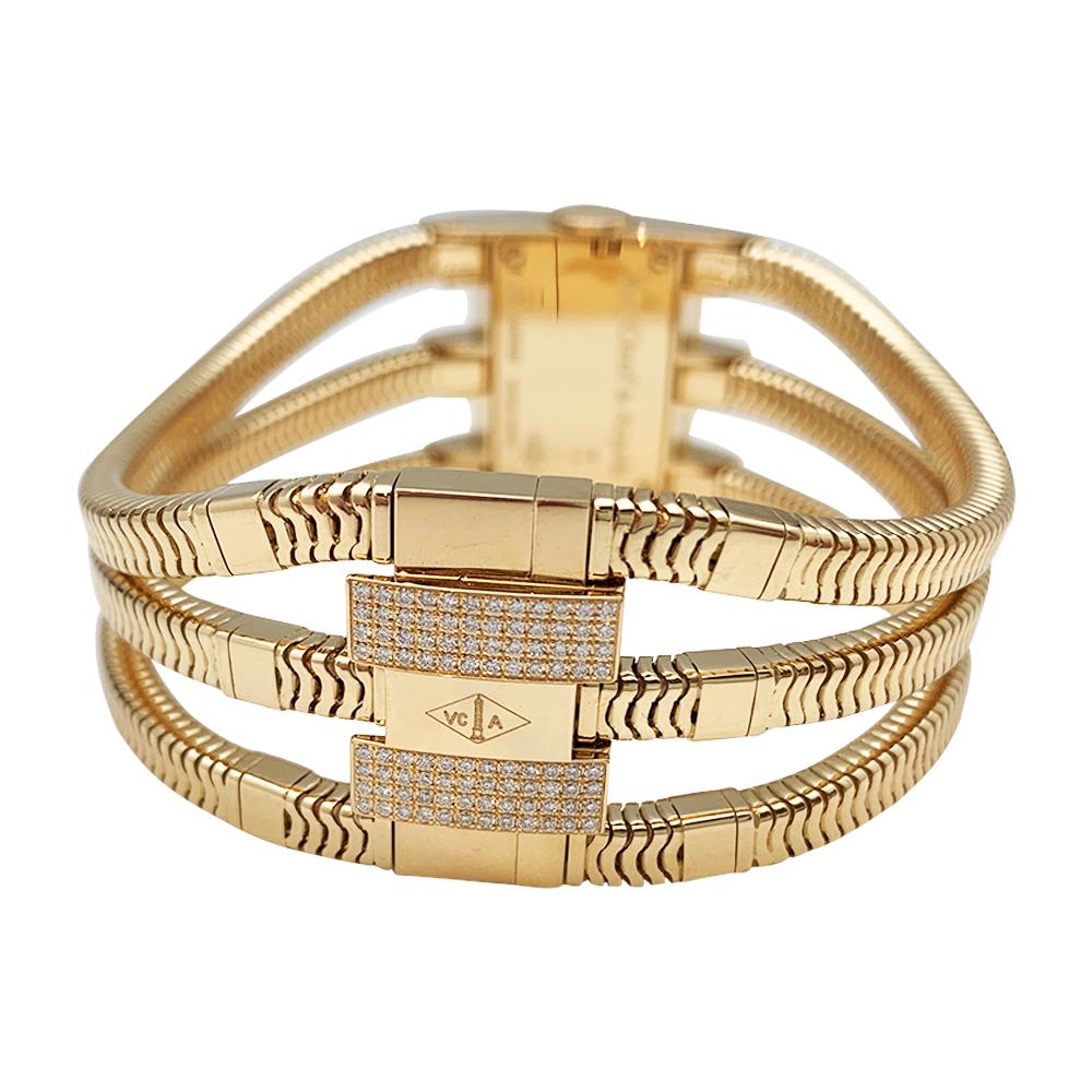 Van Cleef & Arpels watch, 18kt yellow gold and diamonds, rectangular dial with Roman numerals set with diamonds, case and clasp paved with diamonds. 
Triple snake links bracelet adjustable for three different sizes.
Round brilliant cut diamonds VVS1