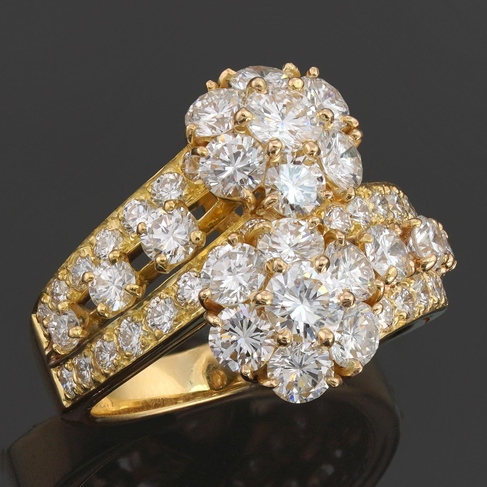 This exquisite authentic Van Cleef & Arpels Snowflake ring is crafted in 18k yellow gold and features with 50 round brilliant D-E-F VVS1-VVS2 diamonds weighing an estimated 3.0 carats. Made in France circa 1990s. Measurements: 0.70