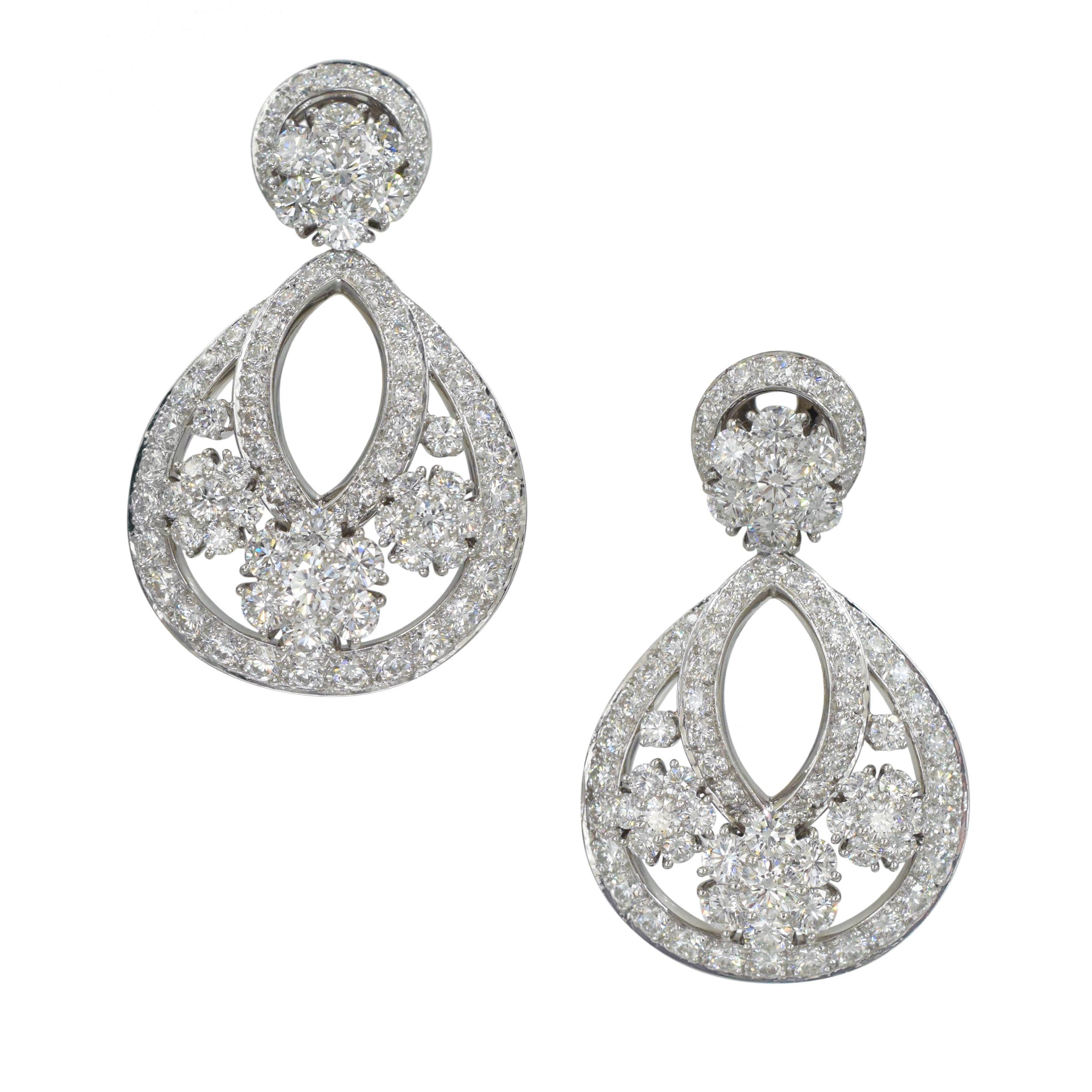 Van Cleef & Arpels Diamond Snowflake Earrings in platinum - small model. The earrigns are set with 170 round brilliant cut diamonds with total weight of
approximately 6.70 carats, color E-F, clarity VVS. Equipped with clip back closure (not