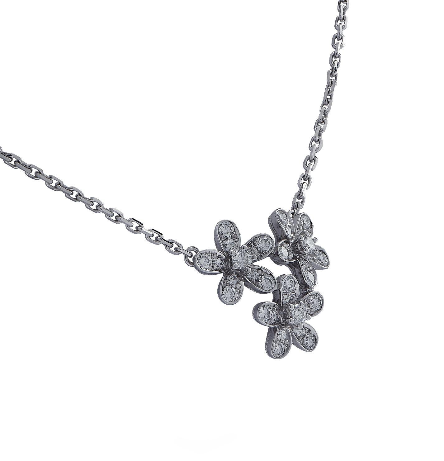 From the House of Van Cleef & Arpels, this exquisite Socrate 3 flowers pendant necklace, is finely handmade in 18 Karat white gold. The diamond encrusted flowers are daintily arranged, capturing the unparalleled beauty of nature. This stunning piece