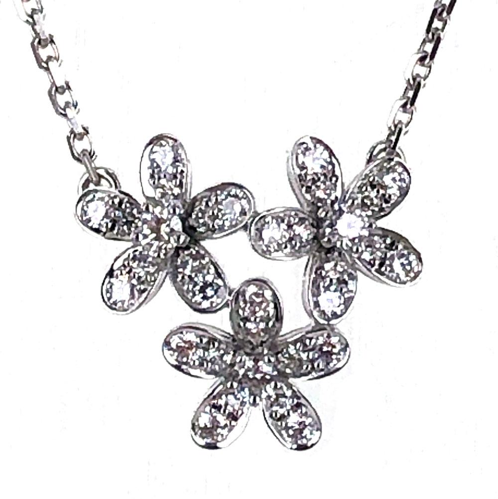 Stunning Diamond Floral Socrate Pendant Necklace by Van Cleef & Arpels. This three diamond floral pendant also features a fourth floral diamond encrusted clasp. There are 44 round brilliant cut diamonds weighing approximately .91 carat total weight.