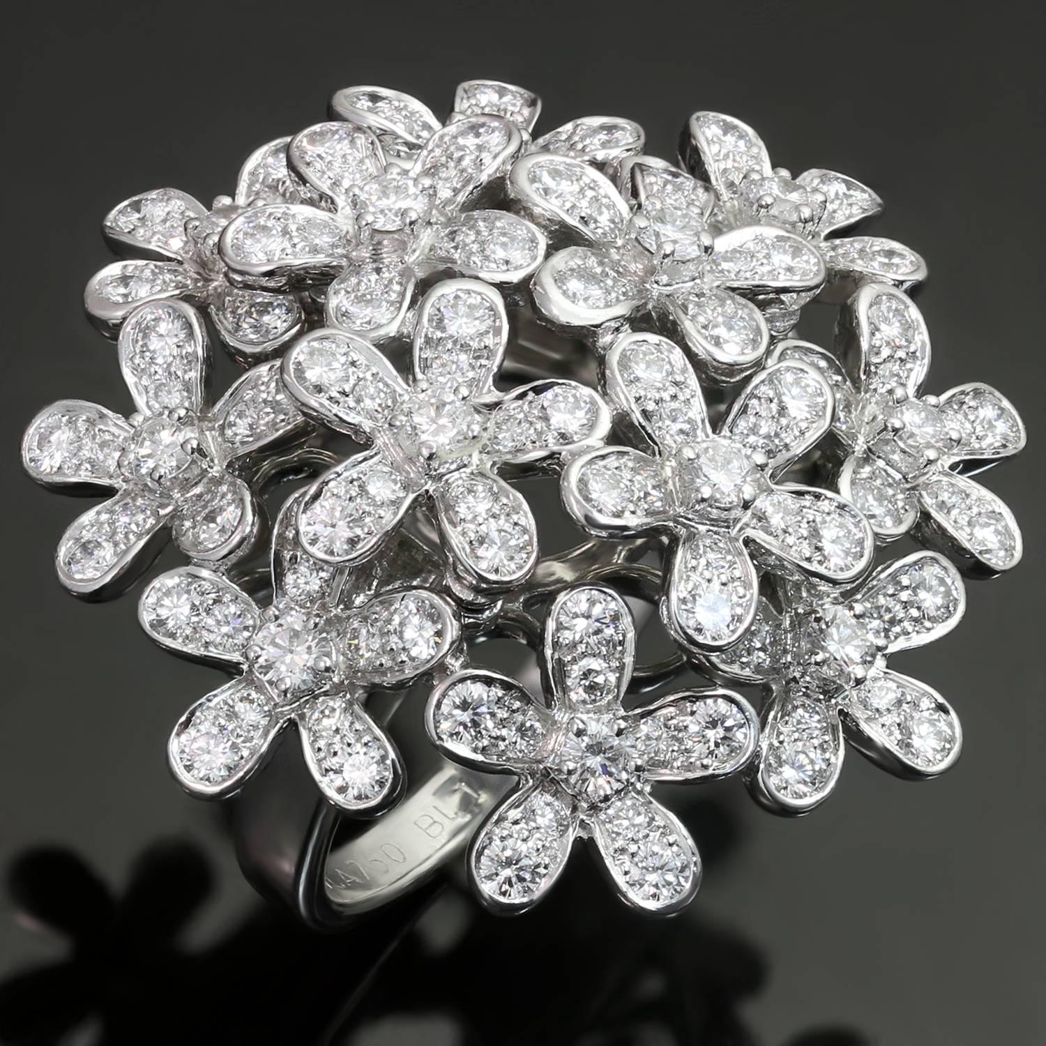 This dazzling Van Cleef & Arpels ring from the impressive Socrate collection features a delicate sparkling floral bouquet crafted in 18k white gold and set with 132 brilliant-cut round diamonds of an estimated 2.64 carats. Made in France circa 2004.