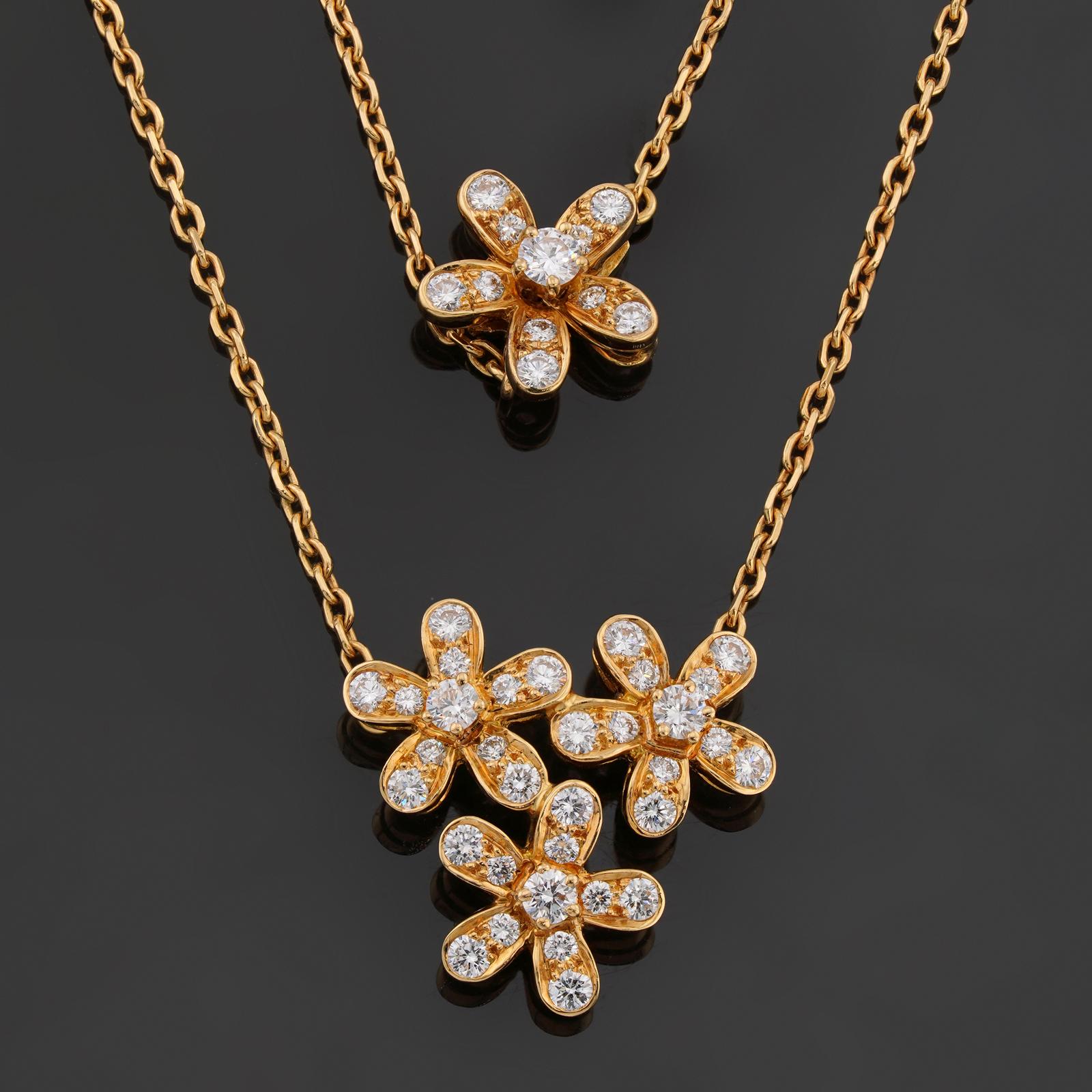 This stunning Van Cleef & Arpels necklace from the Socrate collection features a 3-flower pendant completed with a floral clasp, crafted in 18k yellow gold and set with brilliant-cut round D-E-F VVS1-VVS2 diamonds of an estimated 0.91 carats. Made