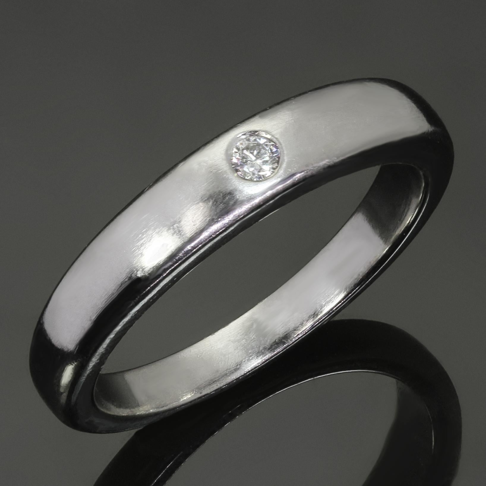 This classic Van Cleef & Arpels band ring is crafted in 950 platinum and set with a solitaire brilliant-cut D-E-F VVS1-VVS2 diamond weighing an estimated 0.05 carats. Made in France circa 2000s. Measurements: 0.15