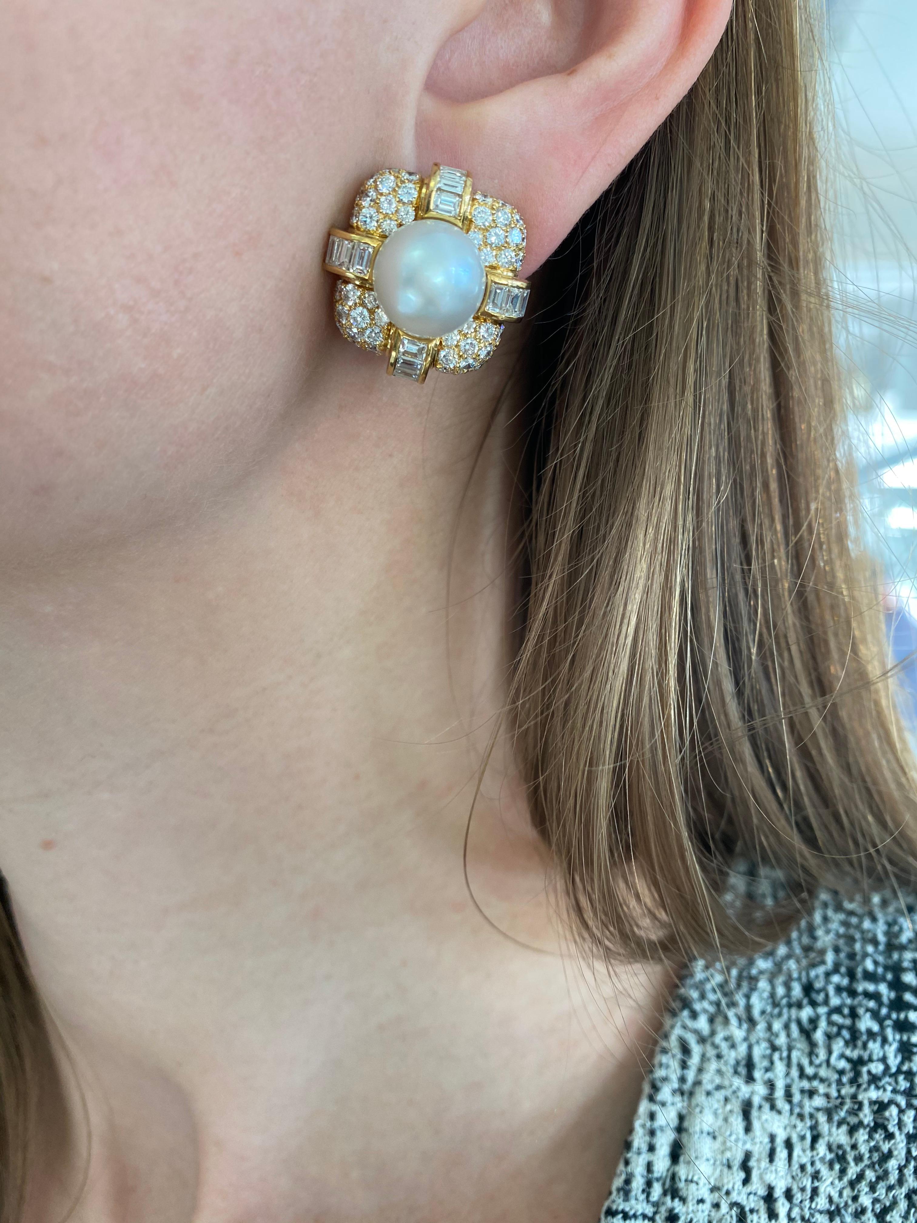 Pair of Gold, South Sea Cultured Pearl and Diamond Earclips by Van Cleef &
Arpels This pair of earrings has the bombé cushion- shaped mounts centering 2 pearls approximately 11.4 mm., pave-set with 120 round diamonds, quartered by bands of 40