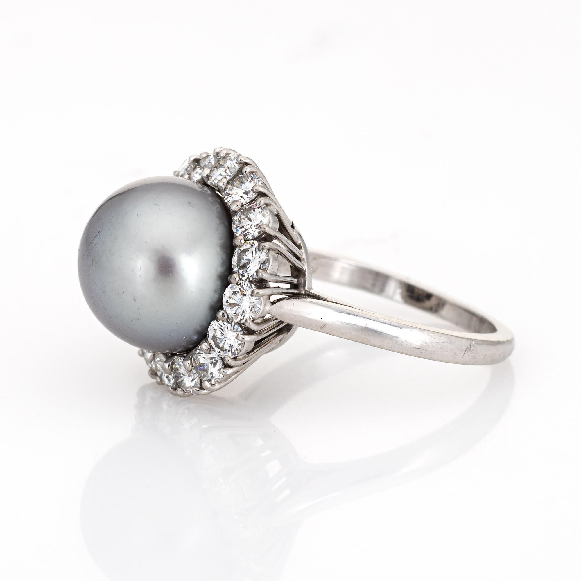 pearl ring surrounded by diamonds